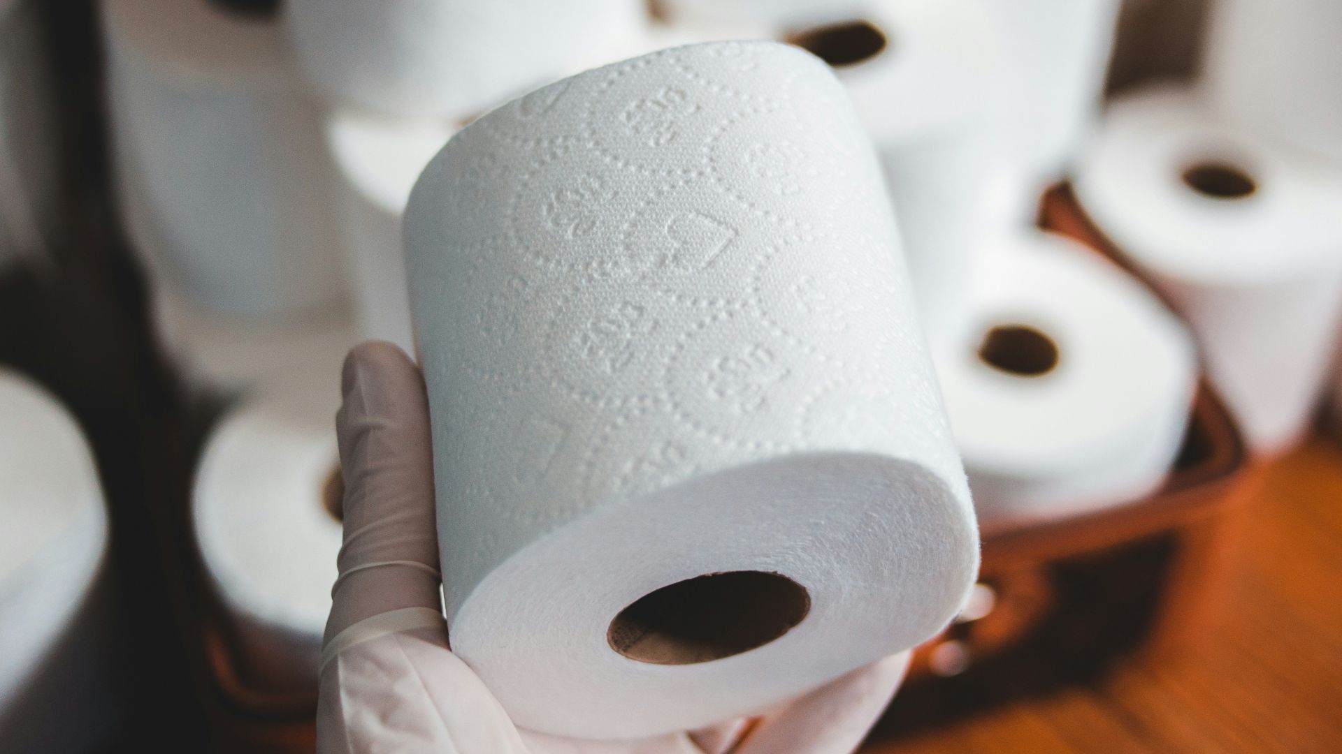 white tissue paper roll on brown wooden table
