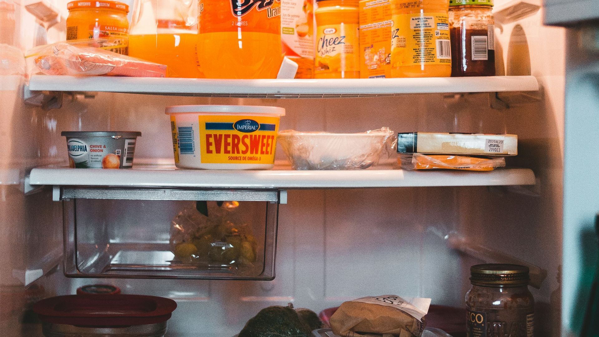 white refrigerator with assorted items