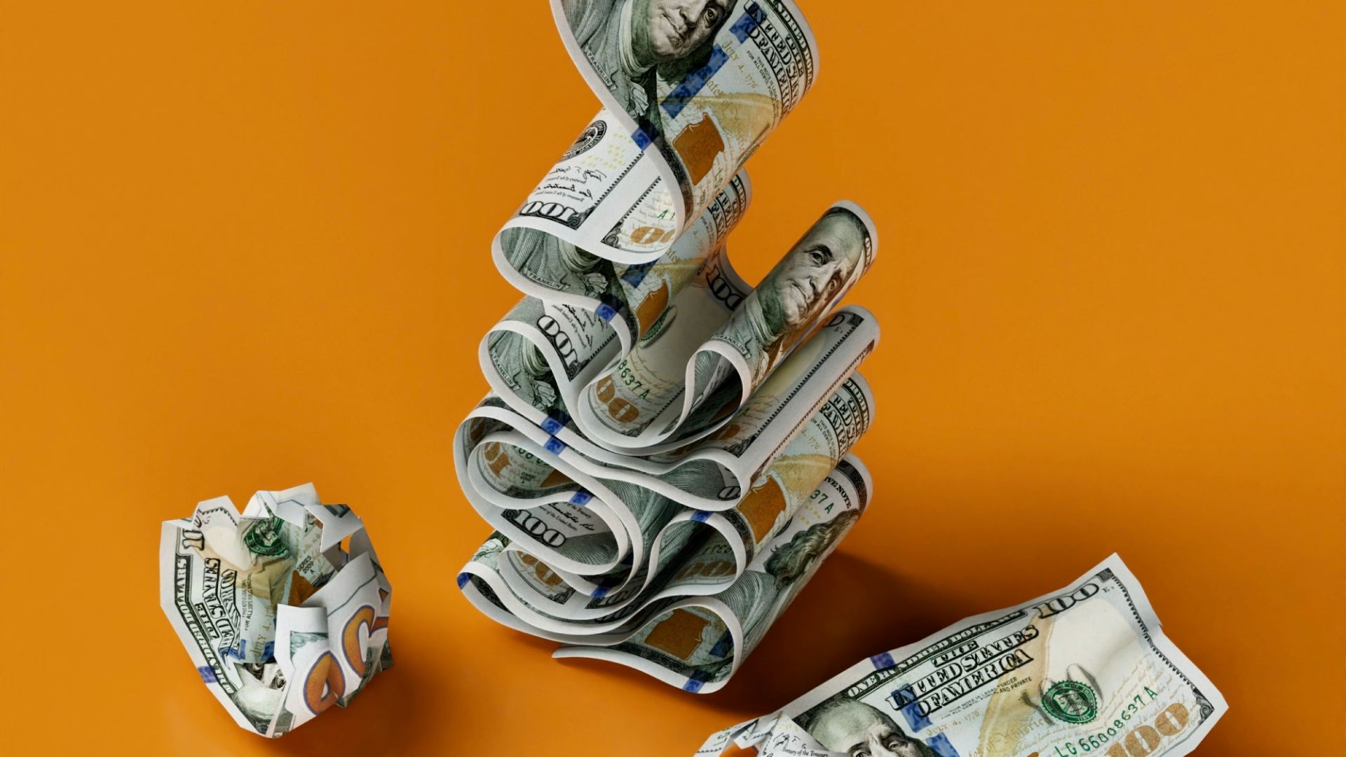 a stack of money sitting on top of a table