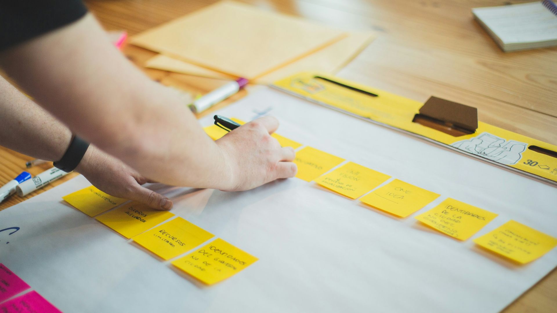 person writing on white paper