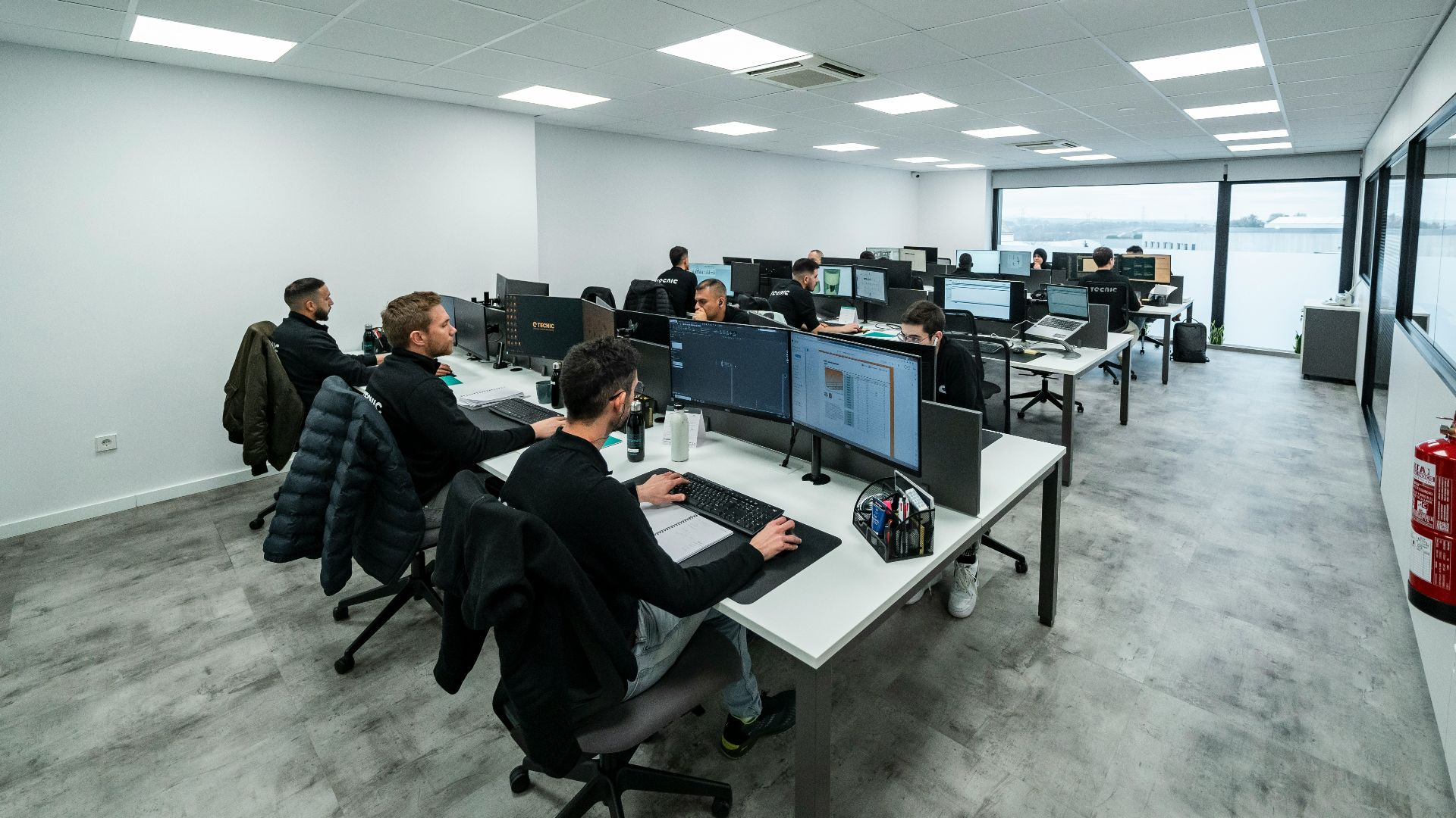 Office workers are busy working on computers.