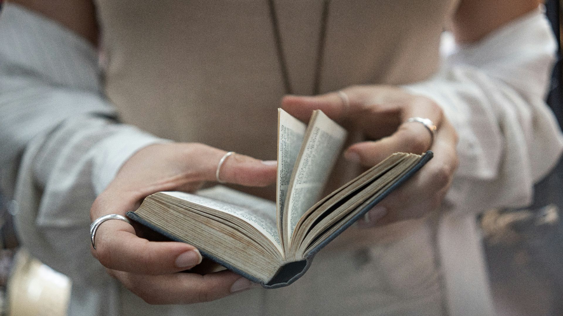 woman flipping over pages of a book