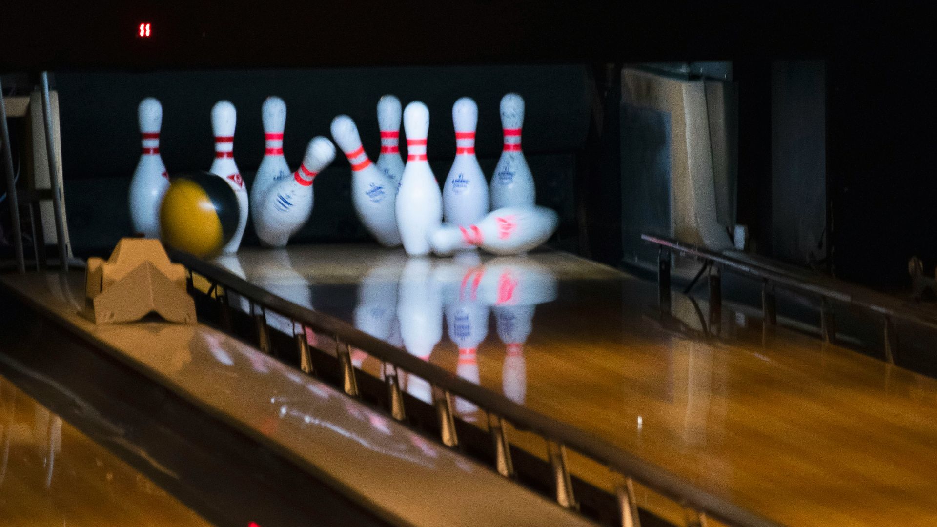 bowling balls hitting pins