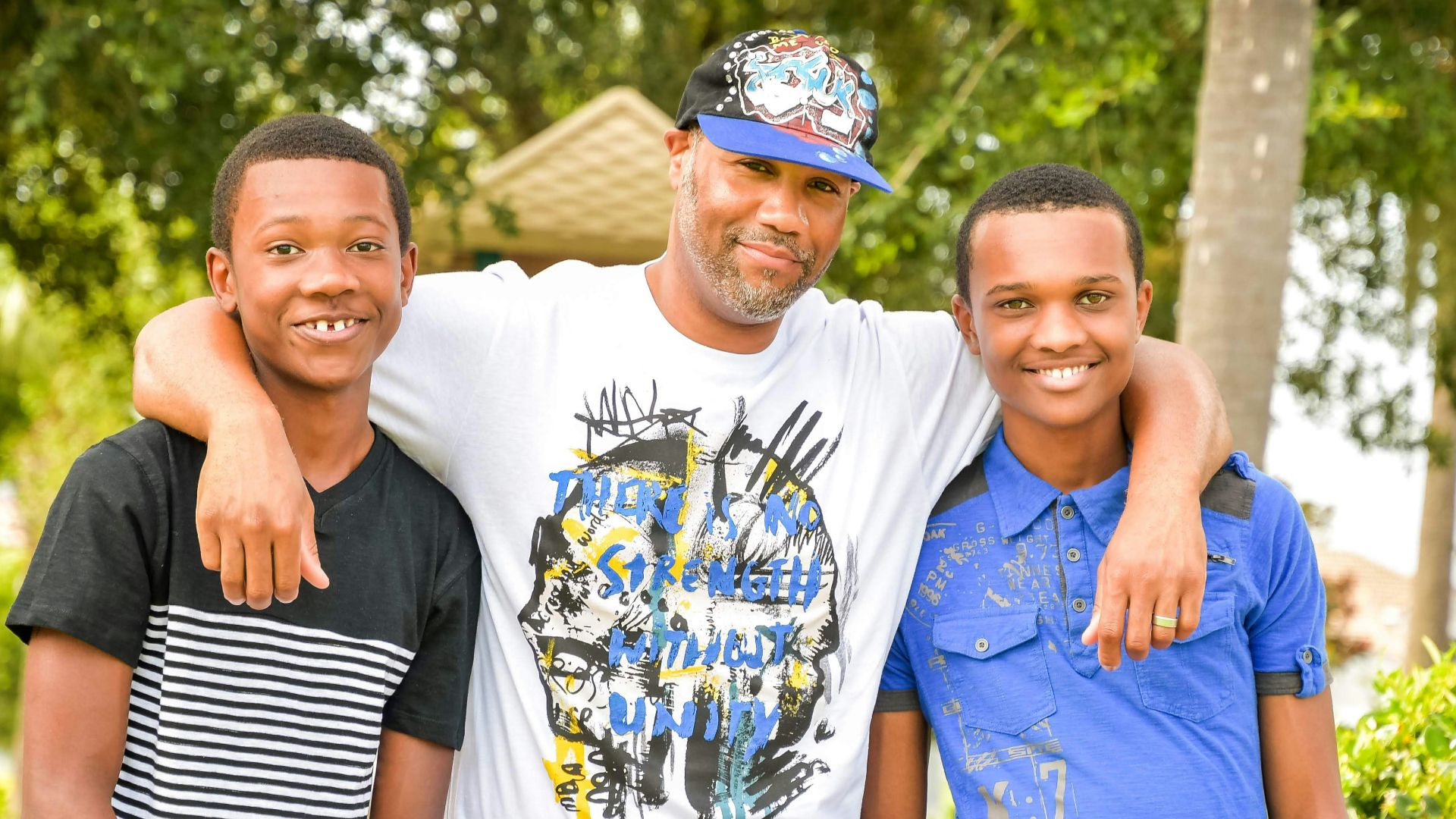 three young men standing next to each other