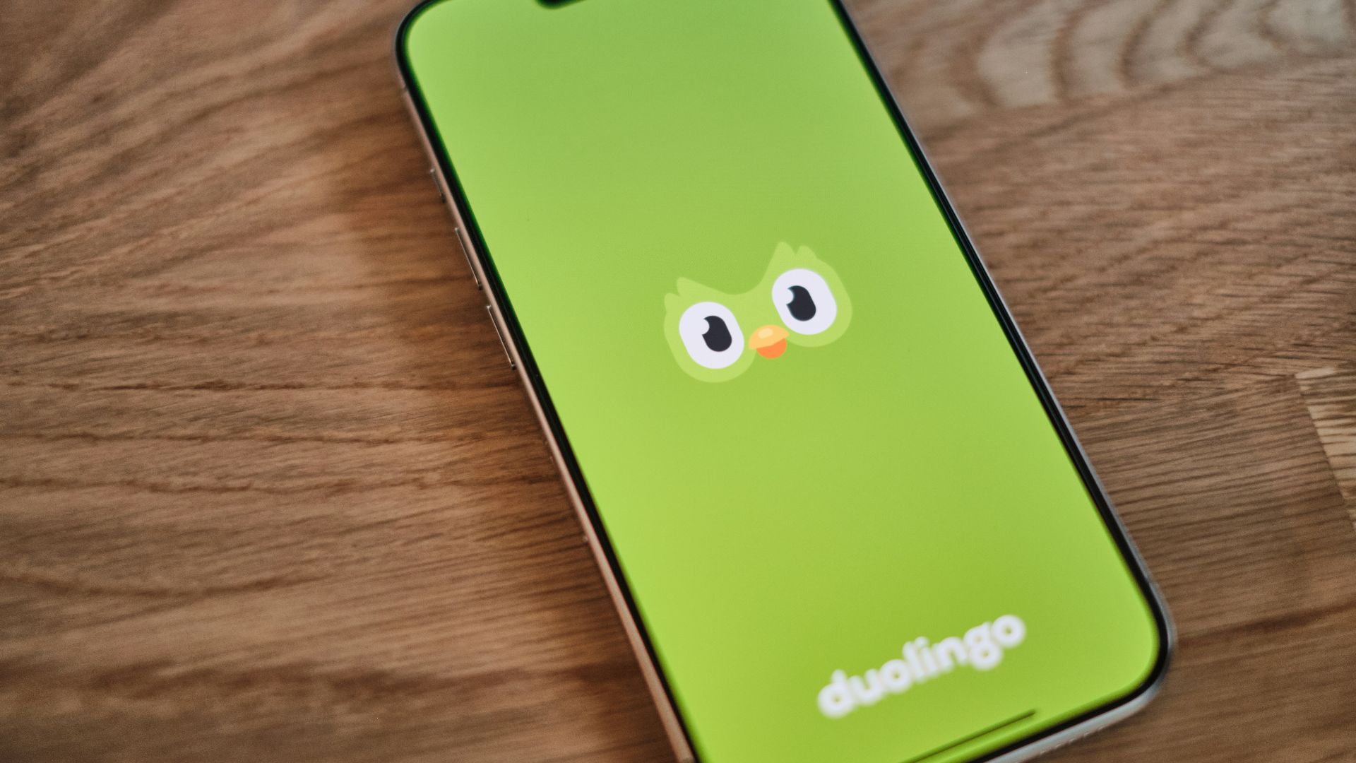 A green phone with a face drawn on it