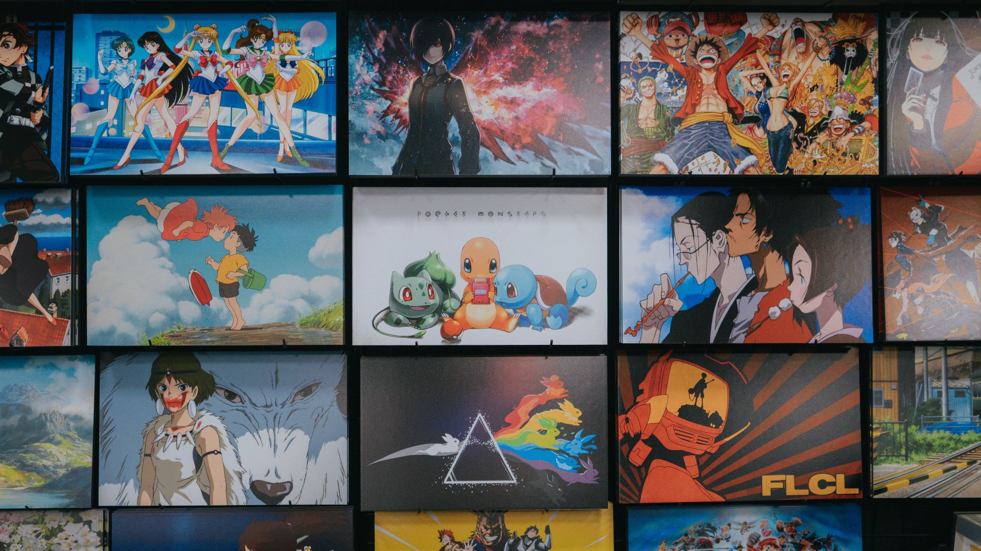 anime character collage photo on black wooden shelf