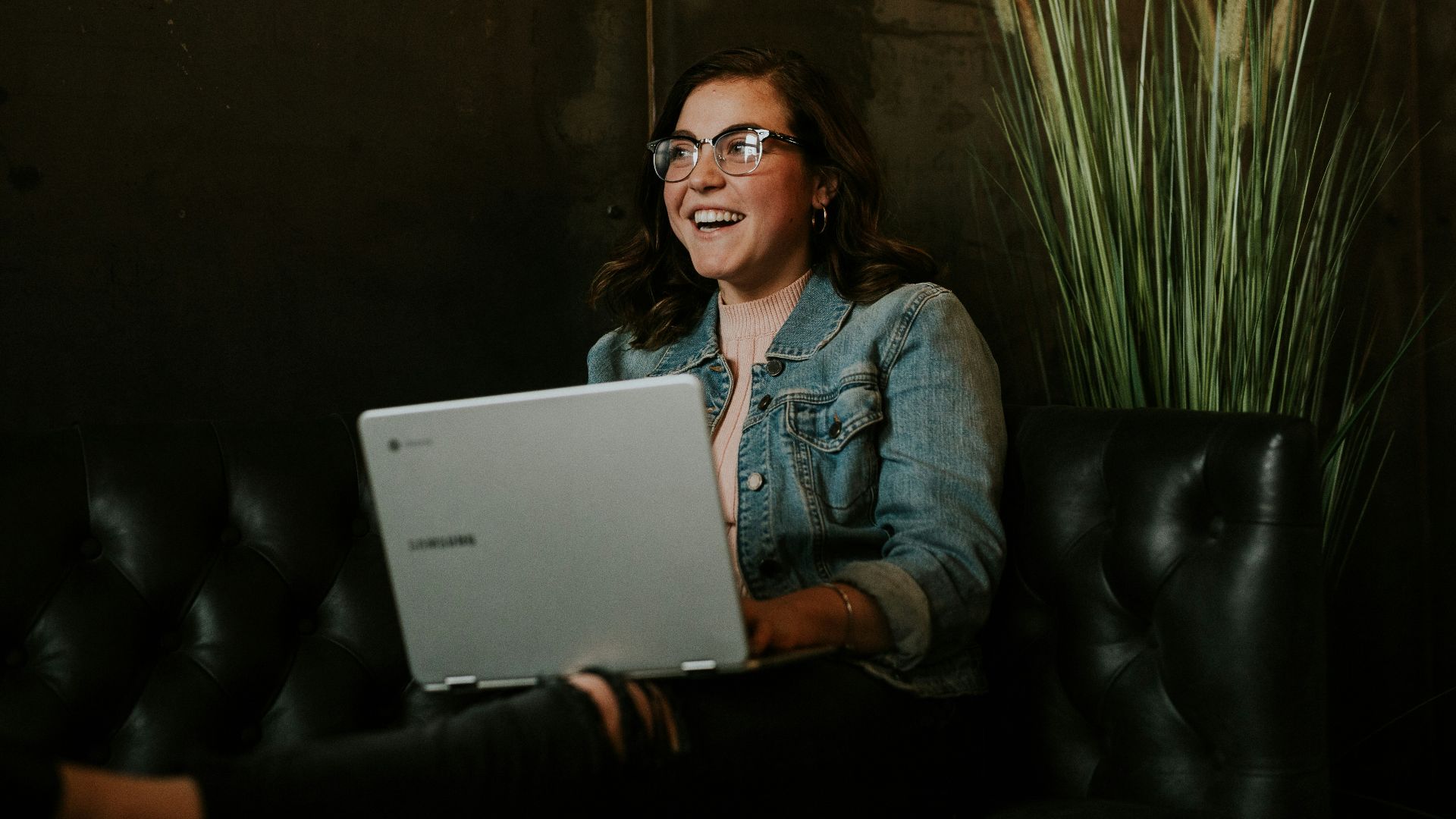 silver laptop on woman's lap