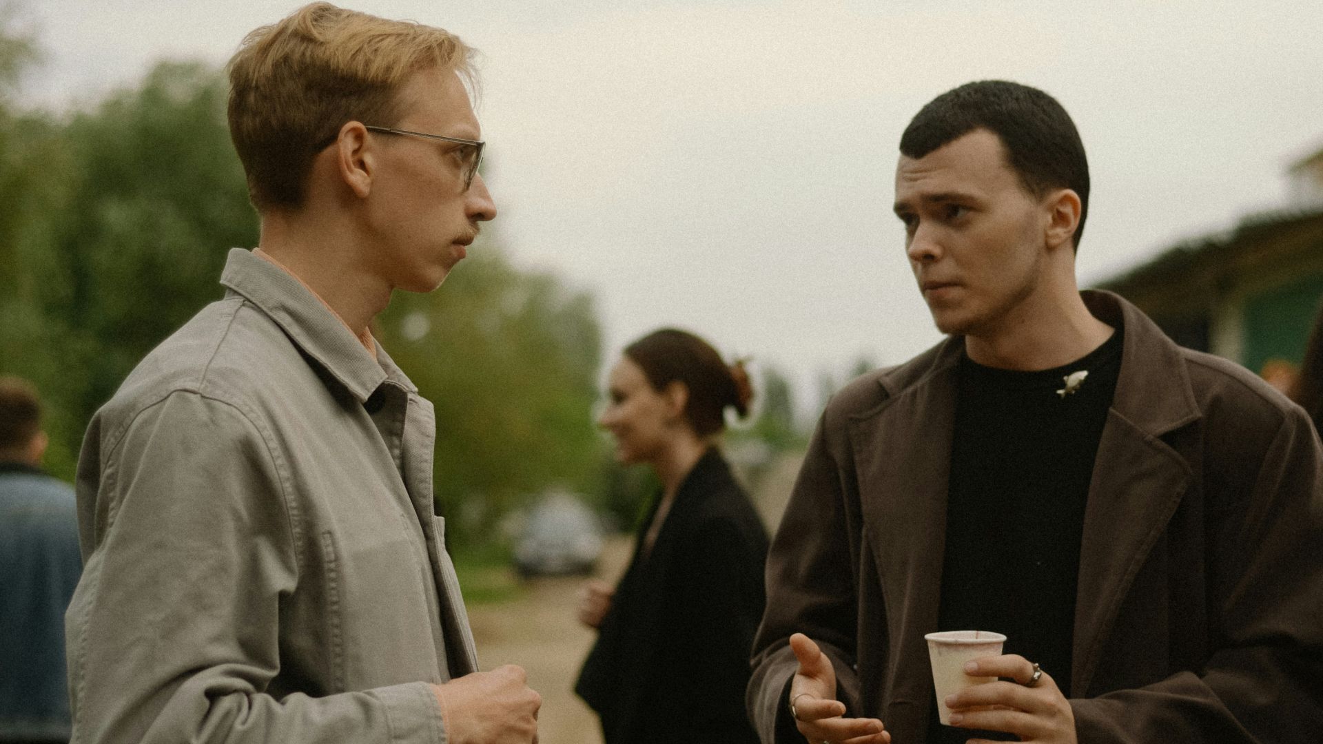 a couple of men standing next to each other