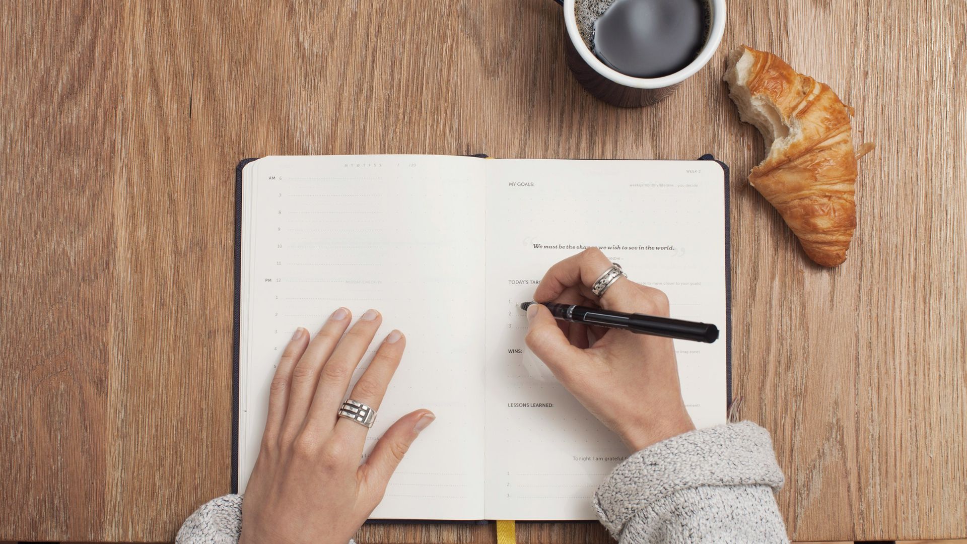 person writing on a book