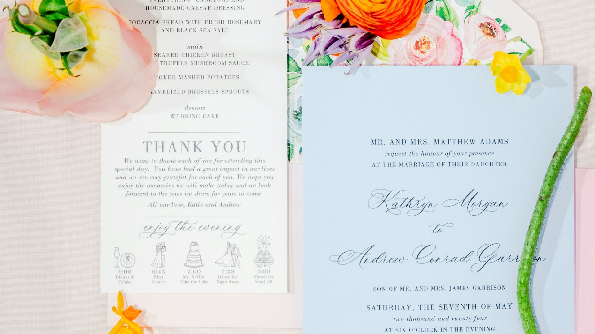 a wedding suite with flowers and a menu