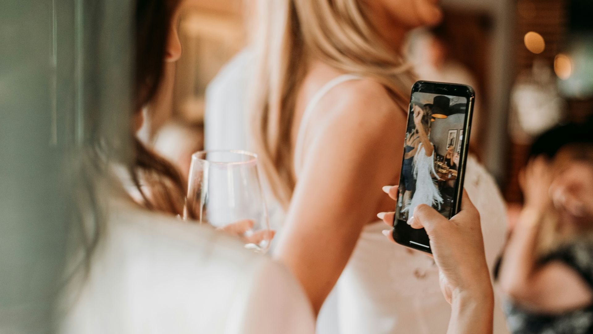 a woman taking a picture of herself with her phone