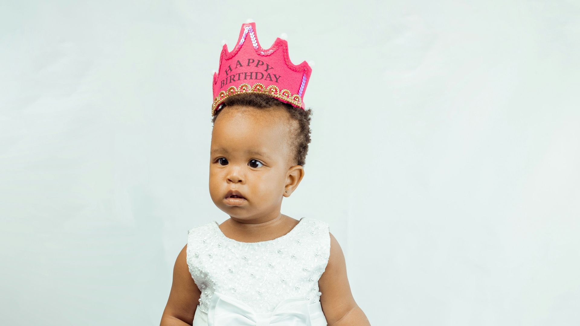 a baby wearing a dress