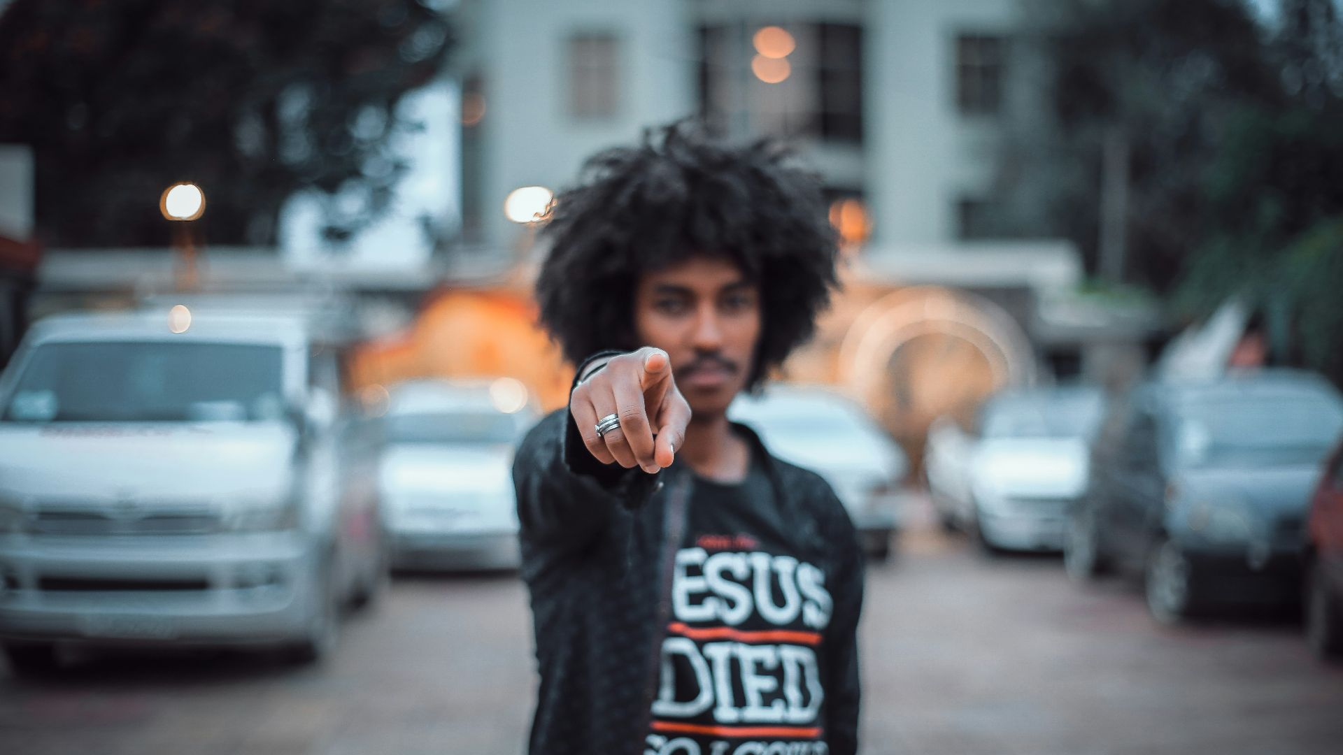 man pointing finger in front of camera