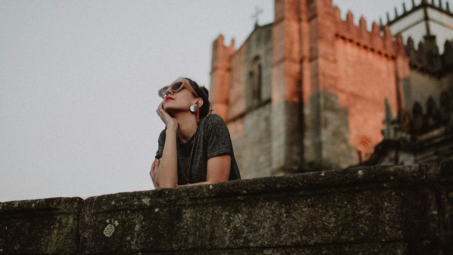 woman near stone castle