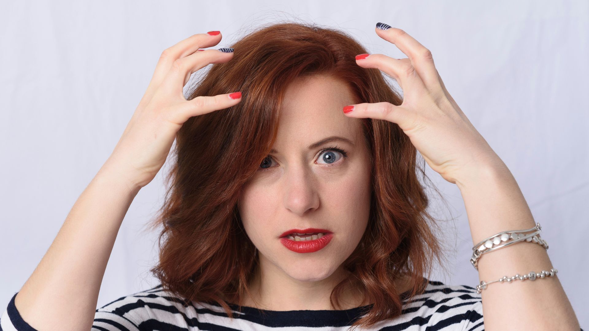 woman in black and white striped long sleeve shirt