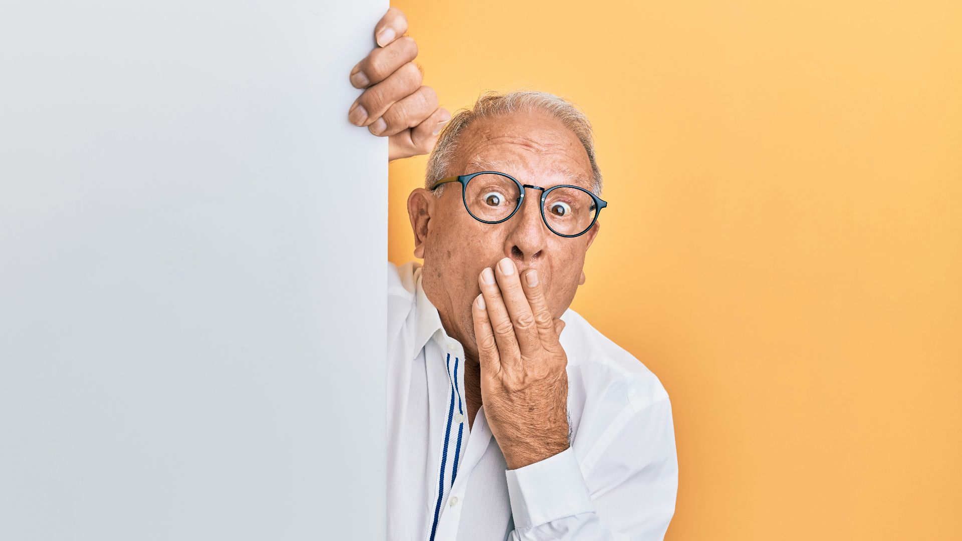 man in white dress shirt wearing black framed eyeglasses