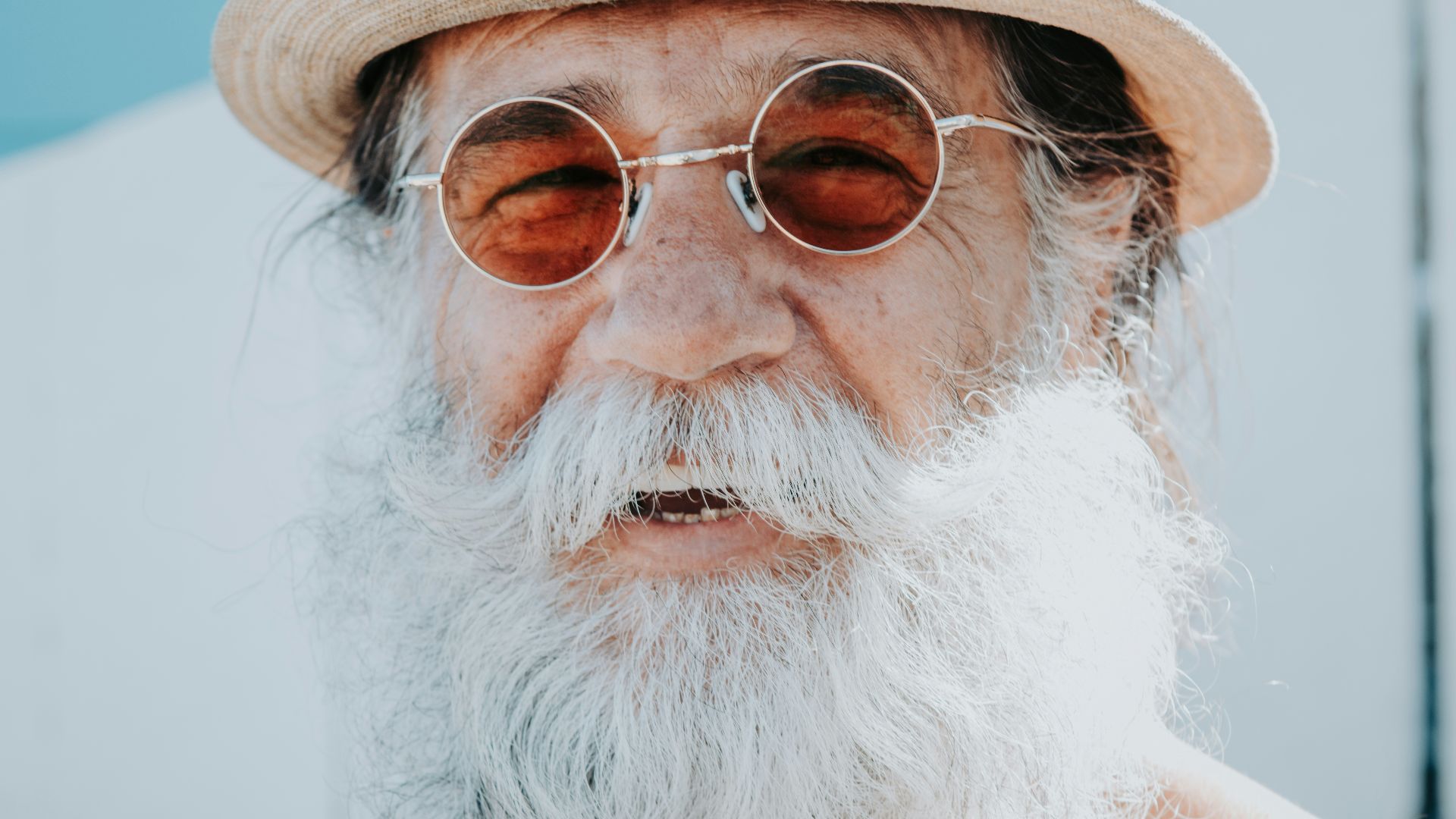 a person with a white beard and glasses