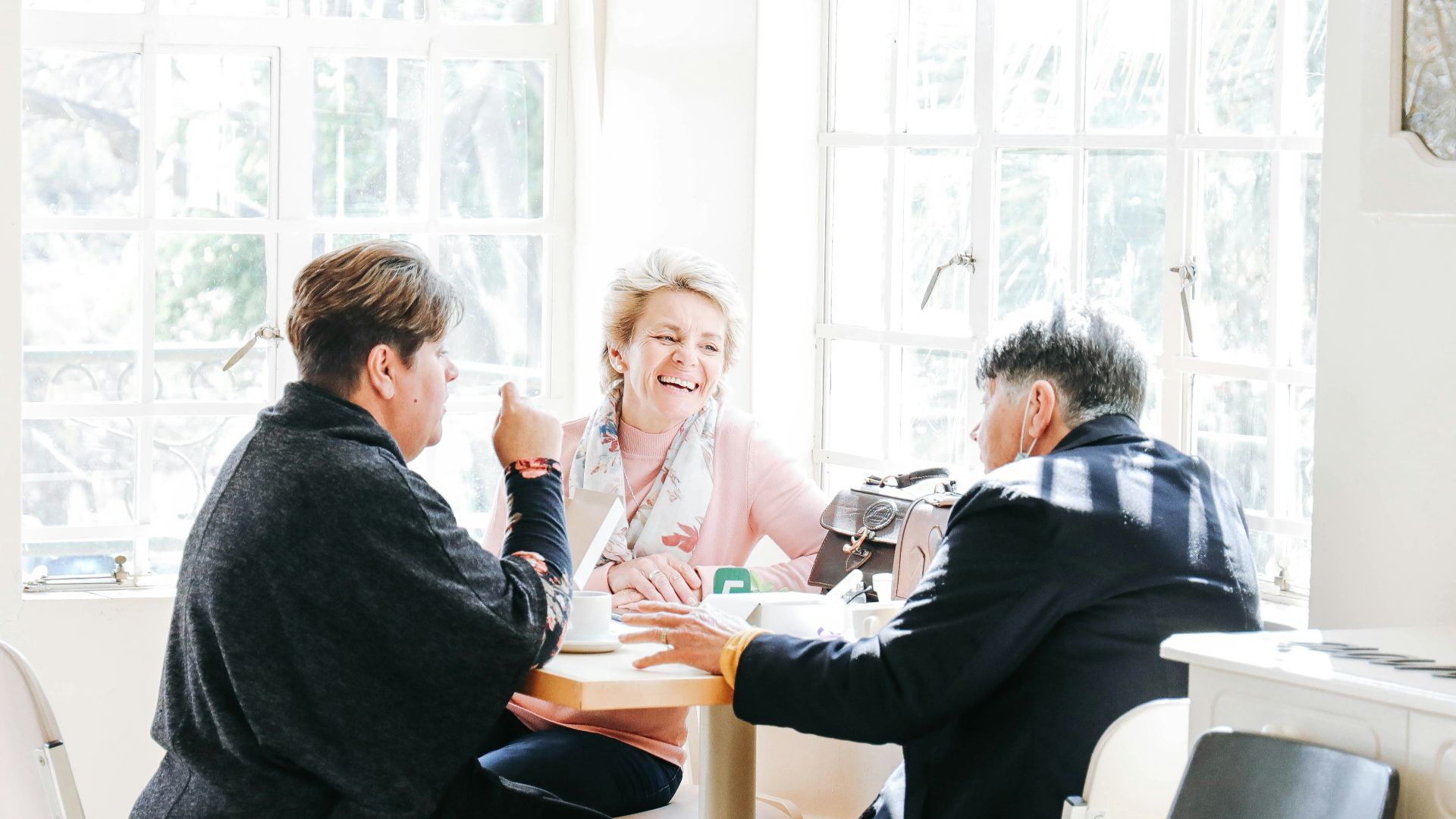 a group of people sitting around a table
