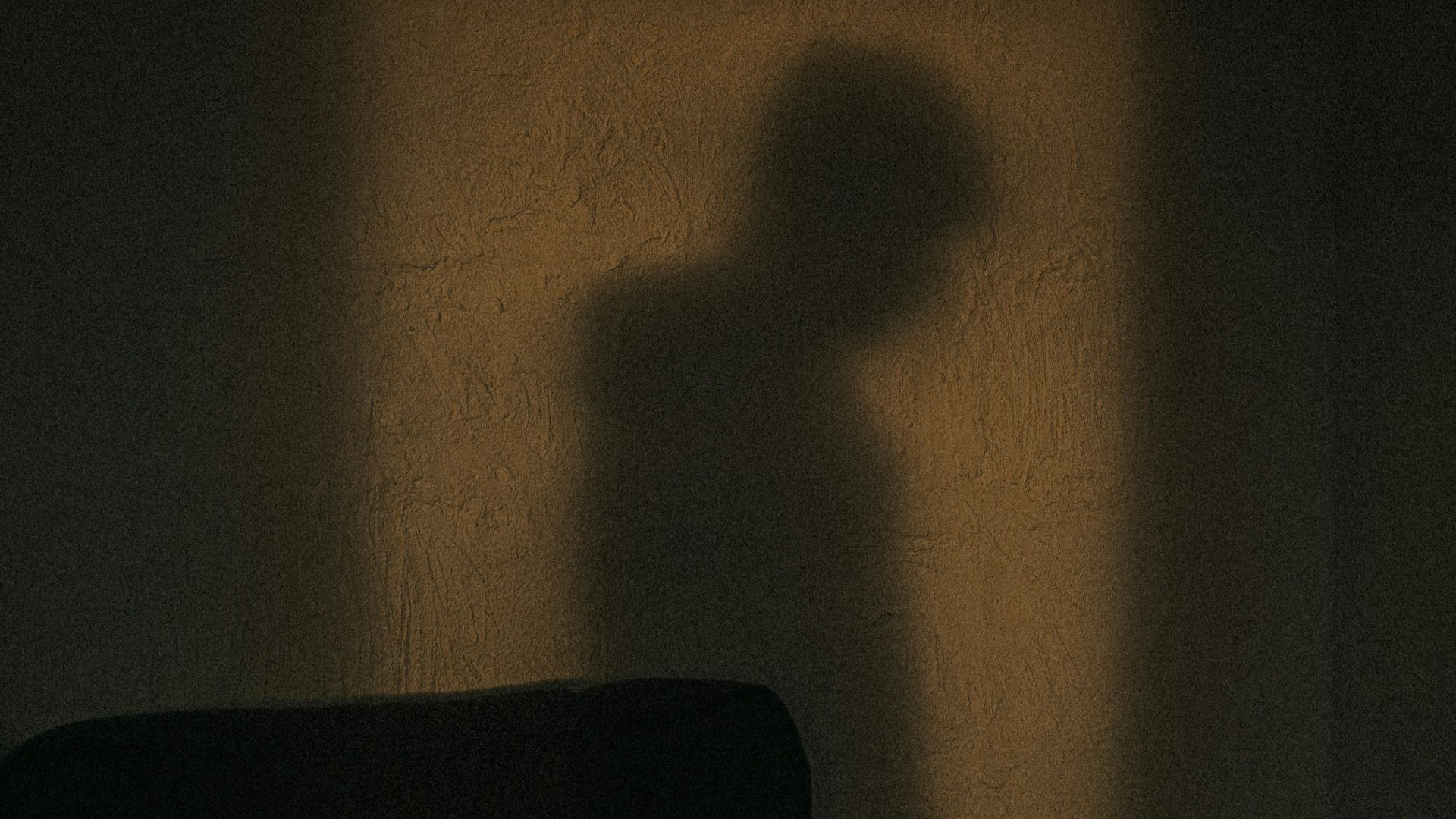 black sofa chair near white wall