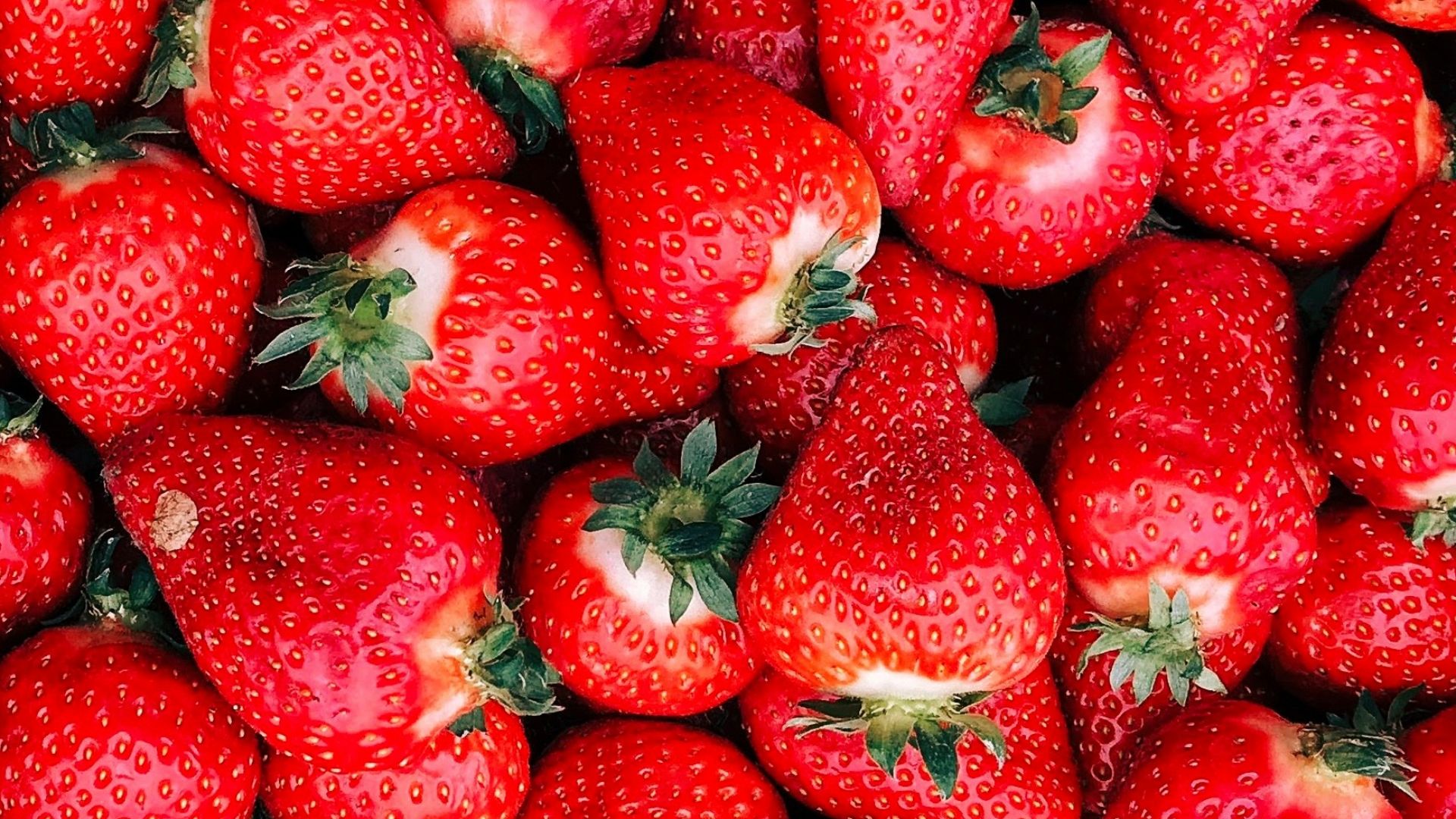 red strawberries on white ceramic plate
