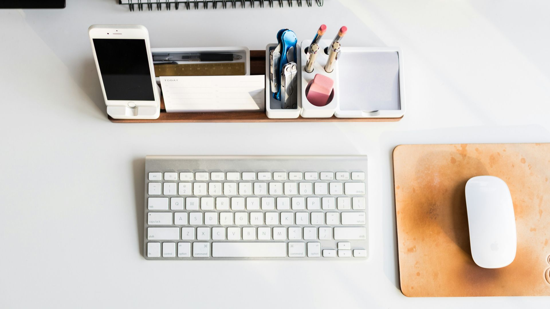 white Apple mouse beside keyboard