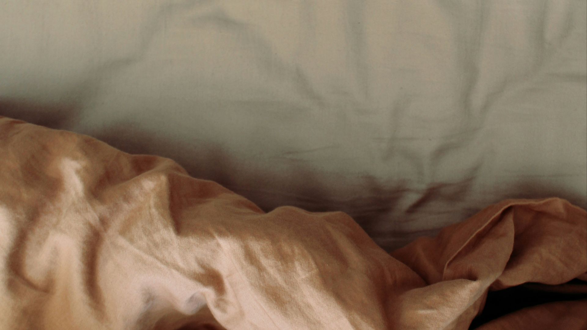 white and brown bed comforter