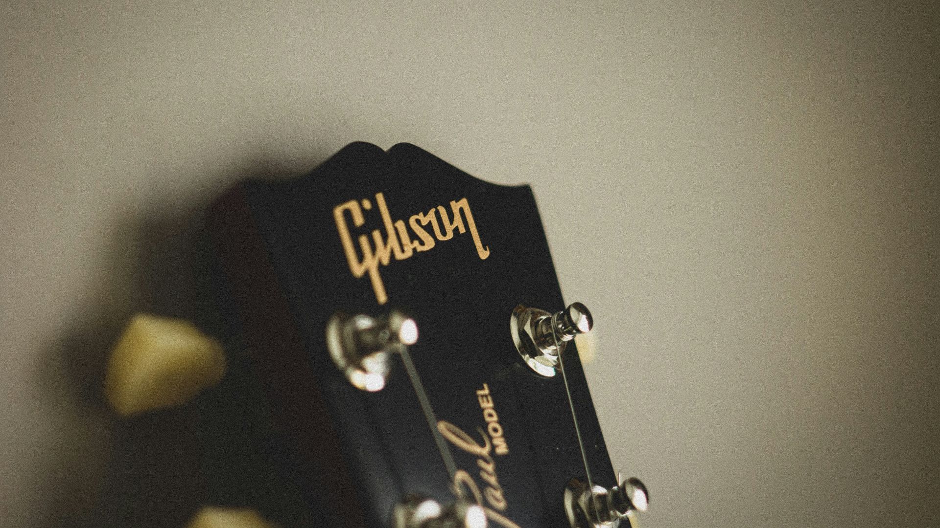 black and gold guitar pick