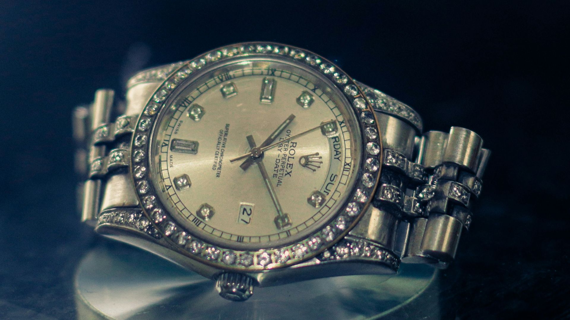 A watch sitting on top of a glass table