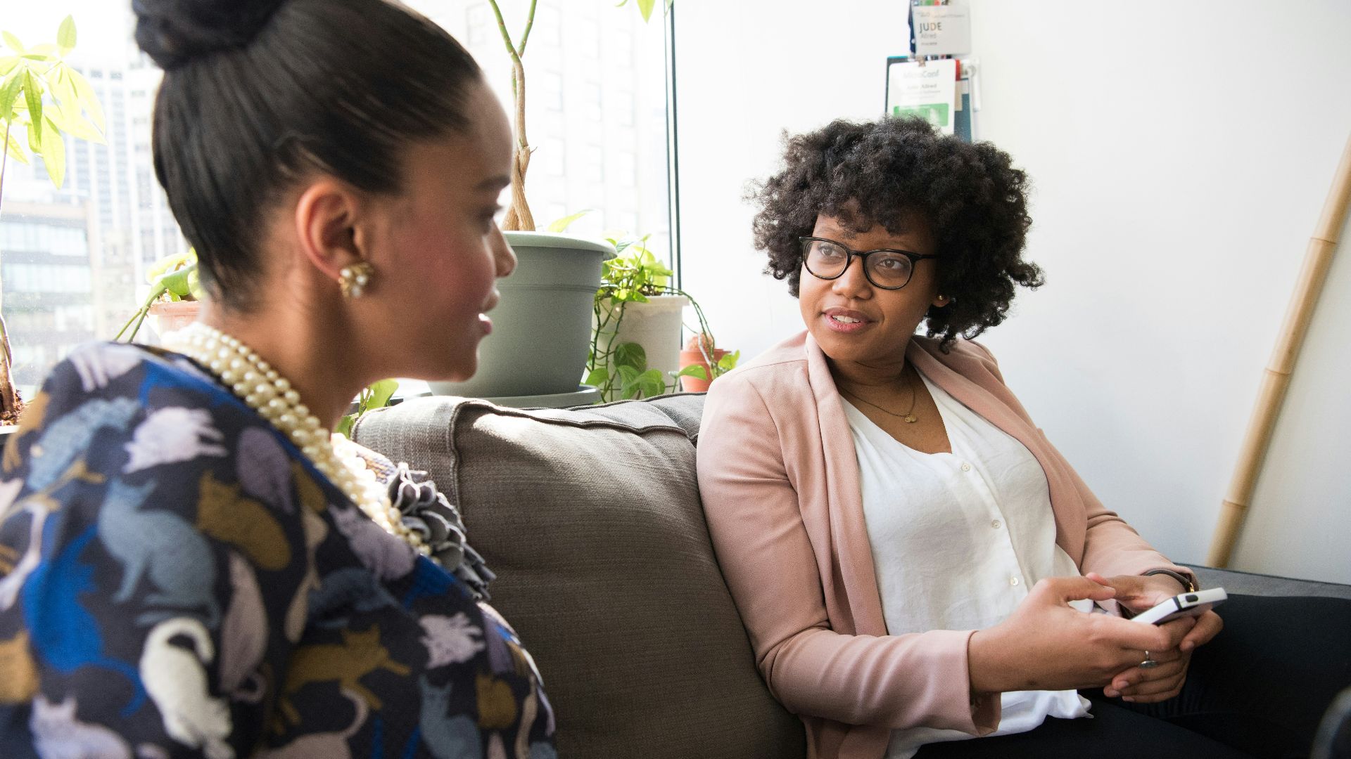 shallow focus photo of woman in beige open cardigan