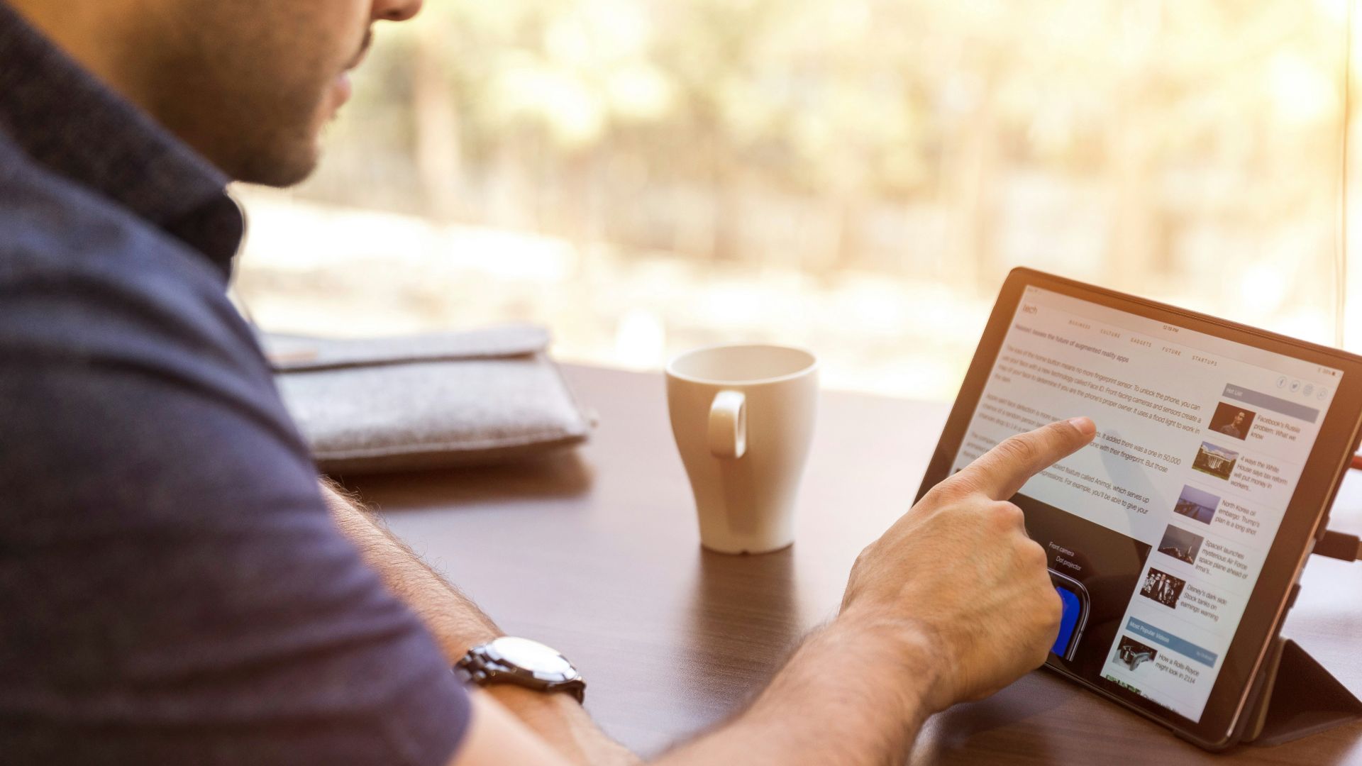 man holding tablet computer