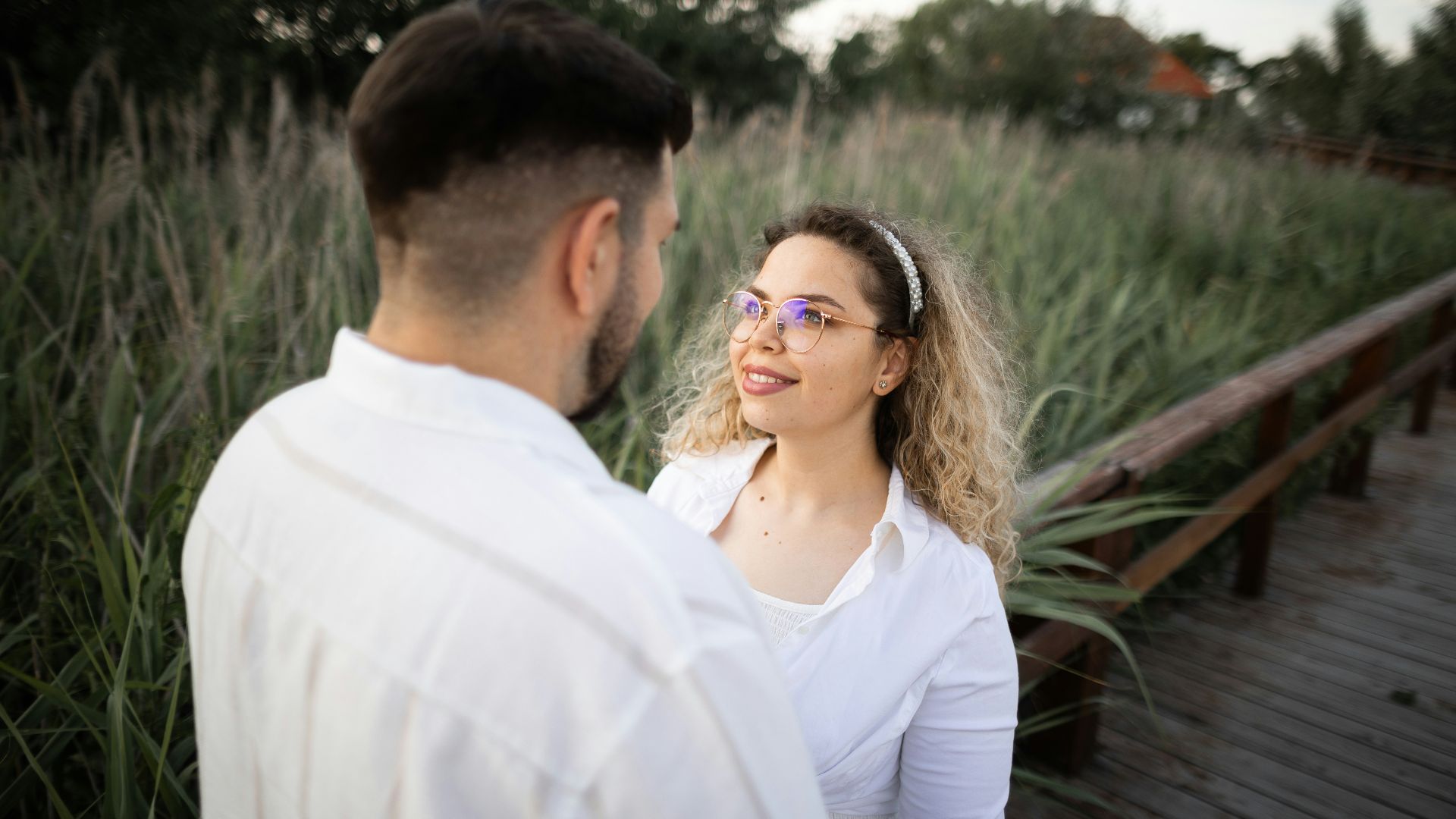 A couple gazes at each other lovingly.