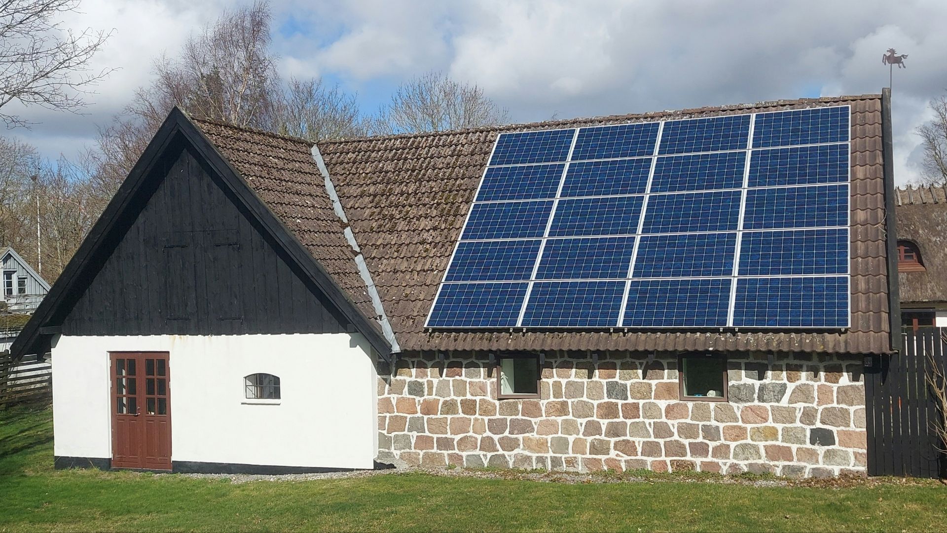a house with a solar panel on the roof