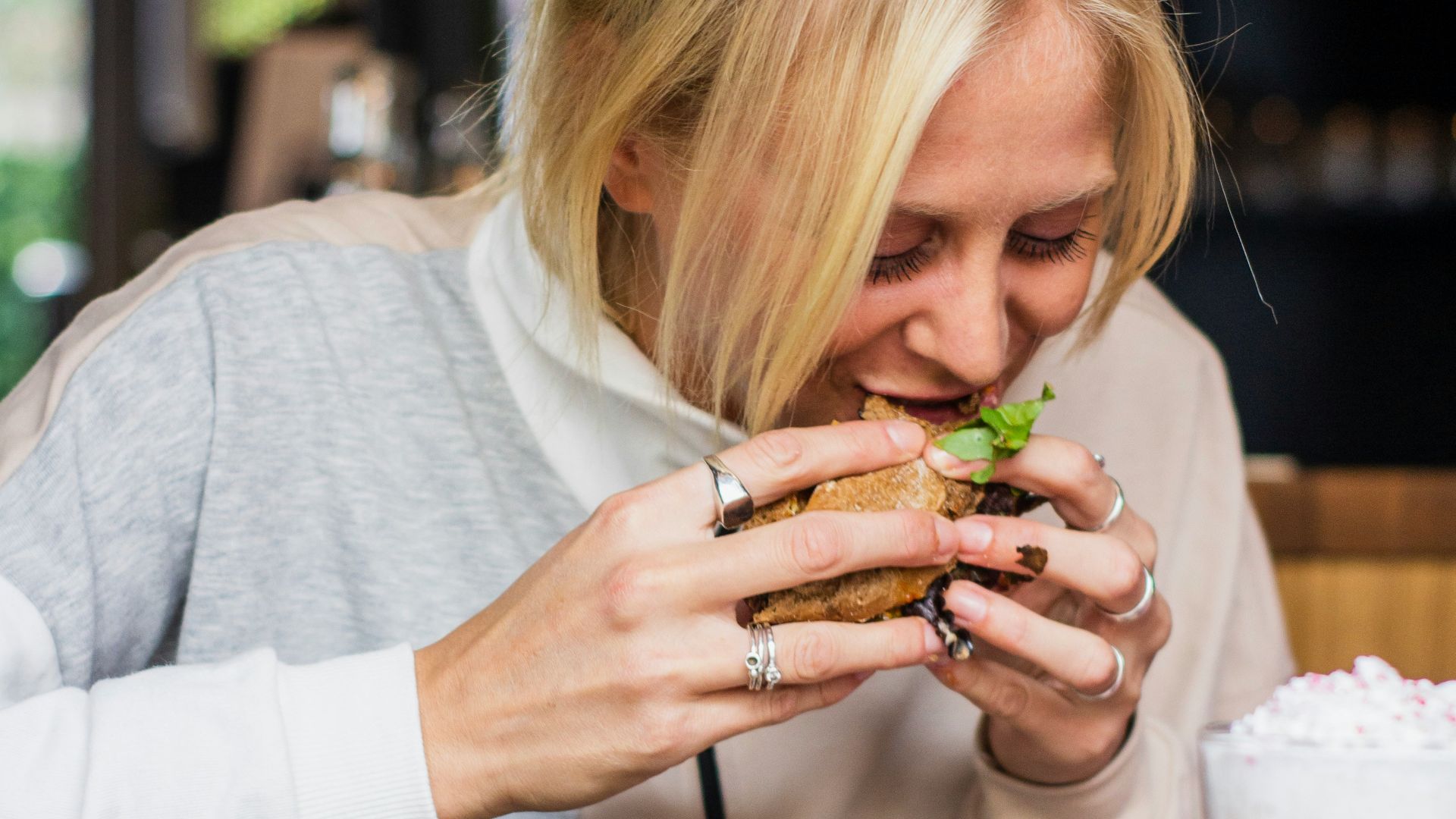 woman eating burger