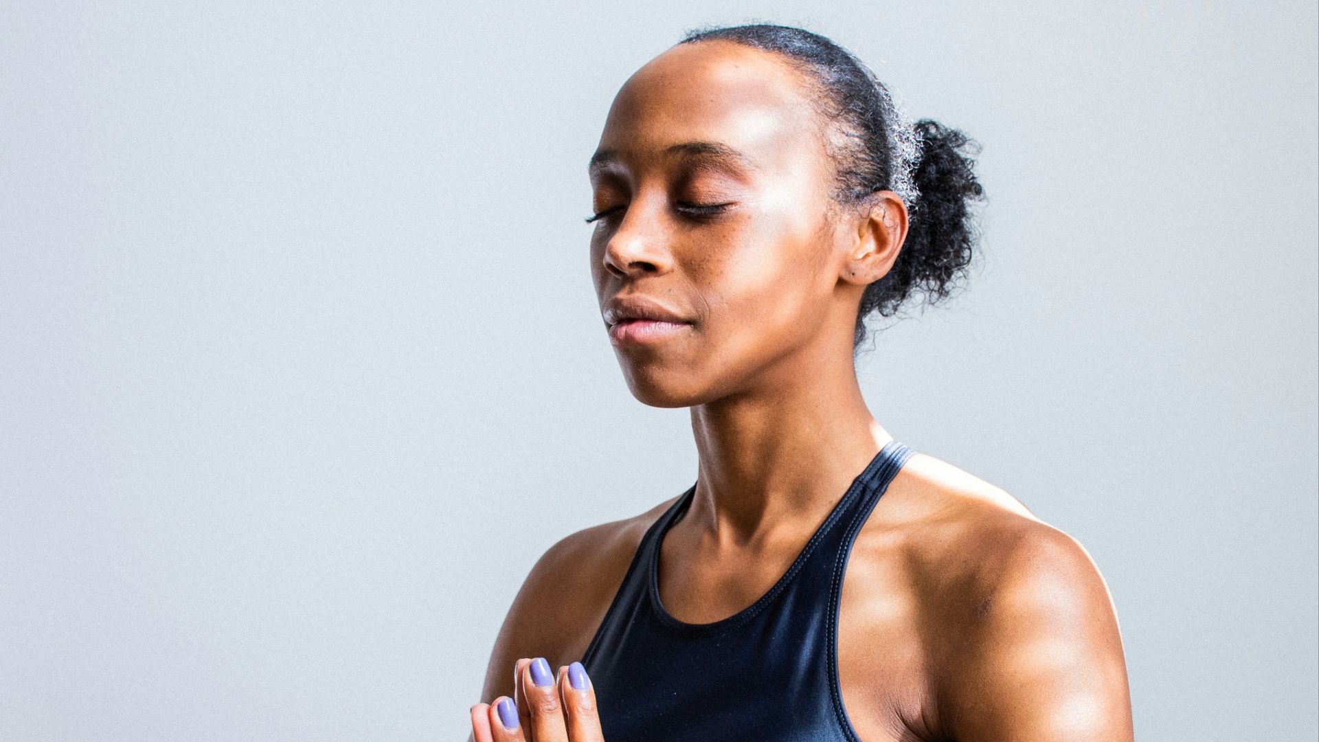 woman wearing black sports bra