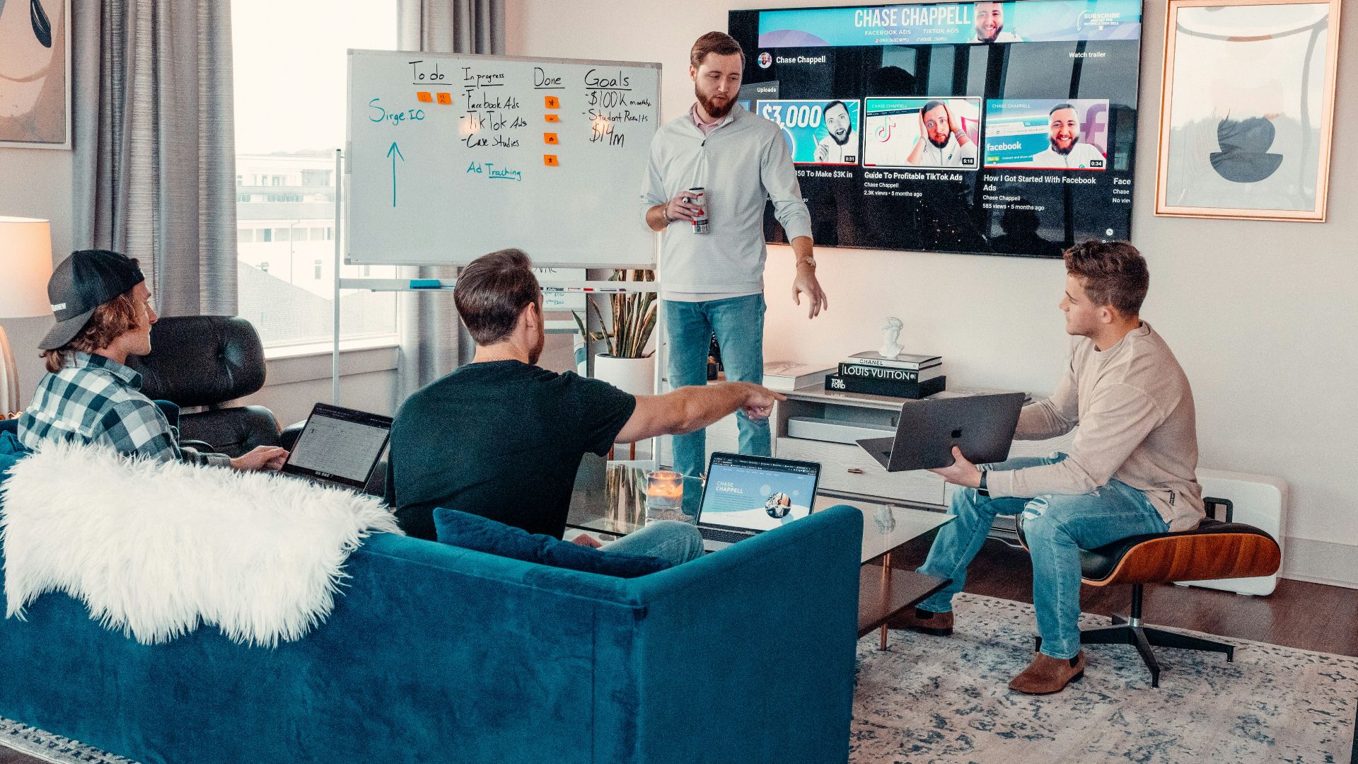 a group of people sitting around a living room
