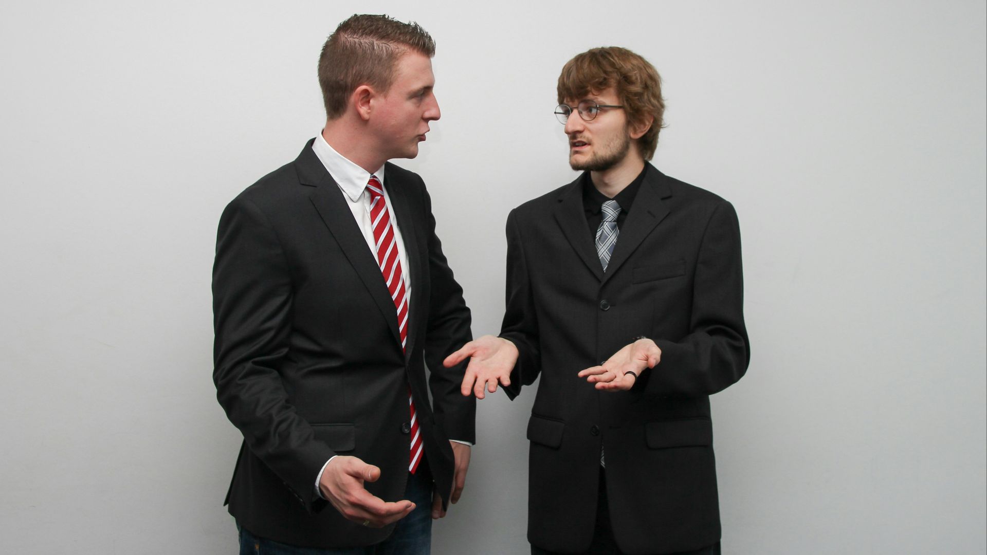 man wearing black suit jacket