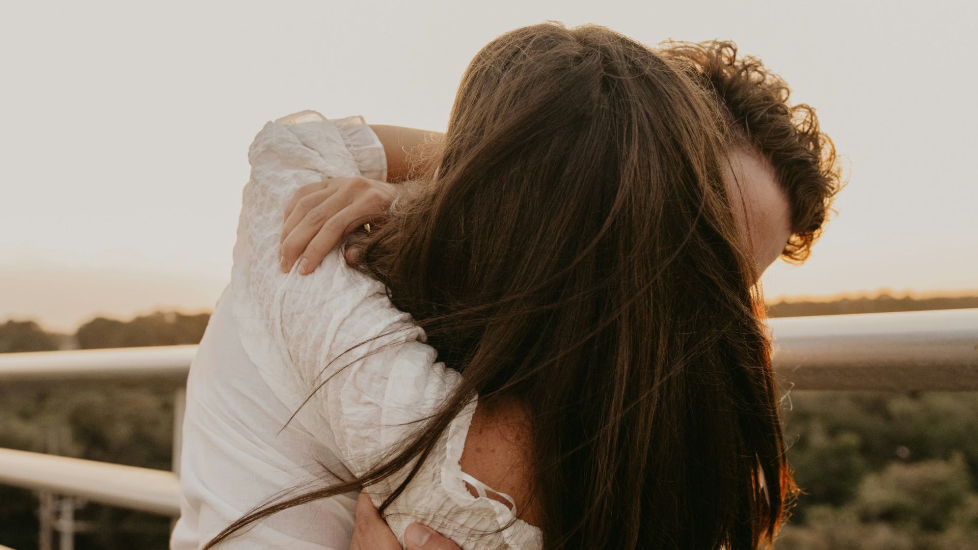 a man and woman kissing