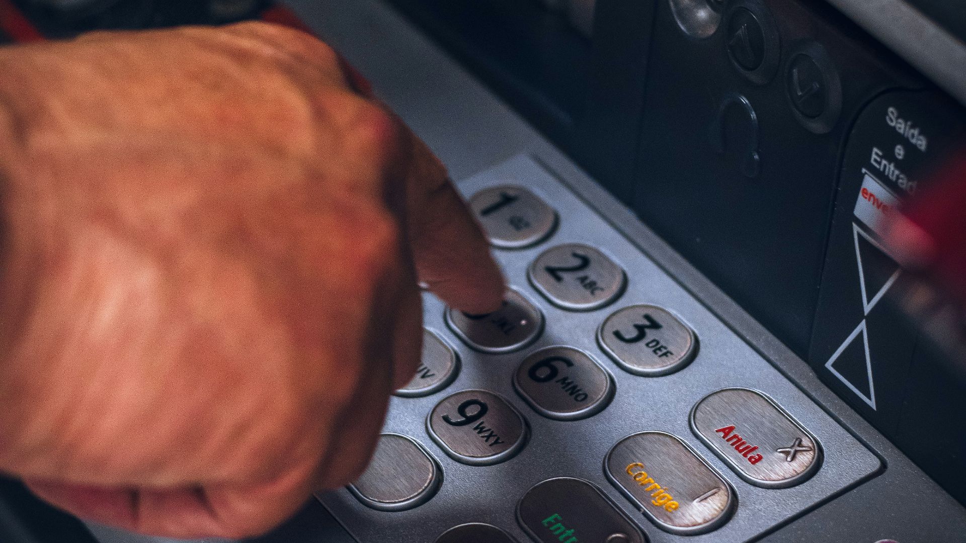 person holding gray and black control panel