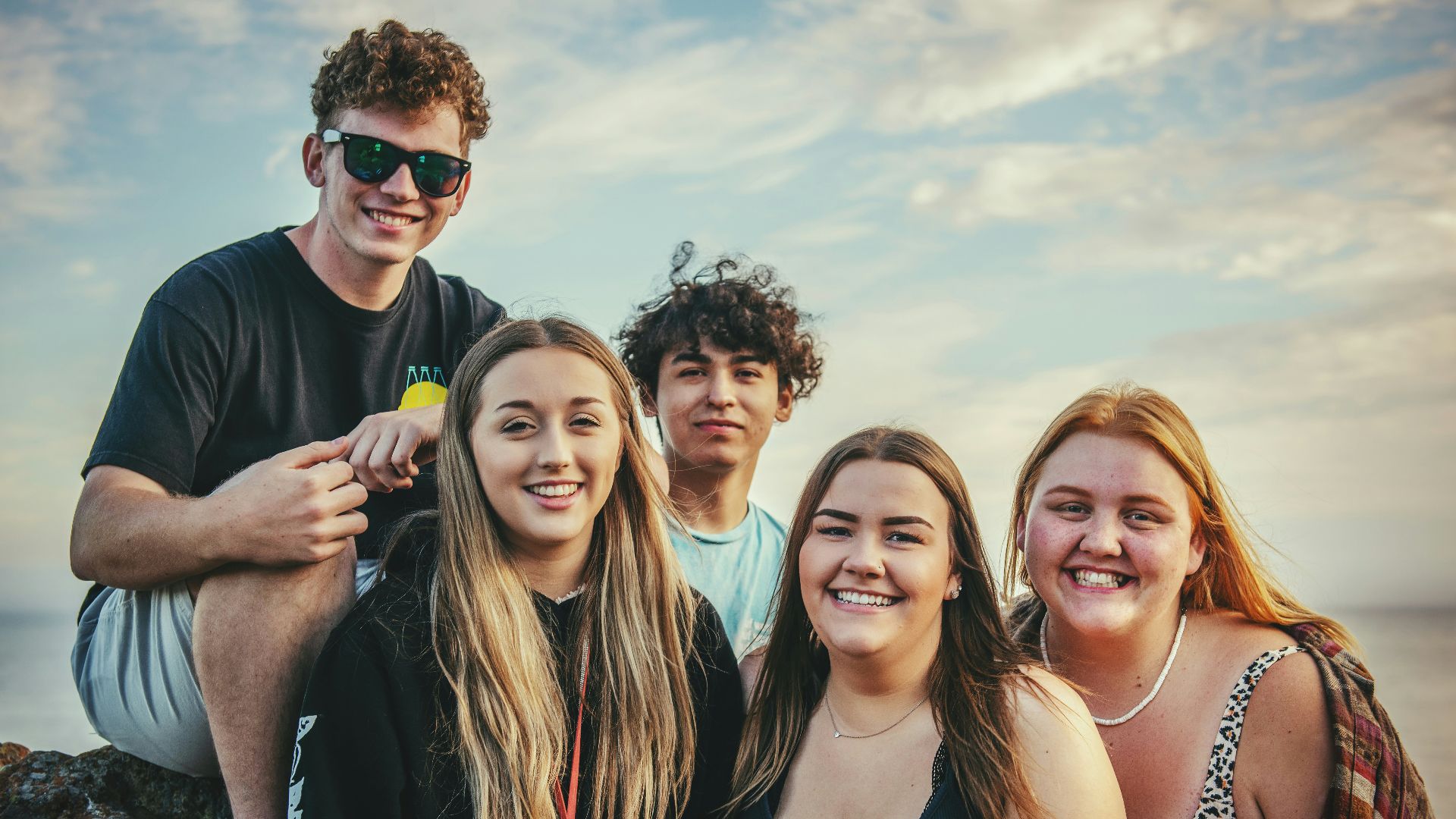 photography of five people near outdoor during daytime
