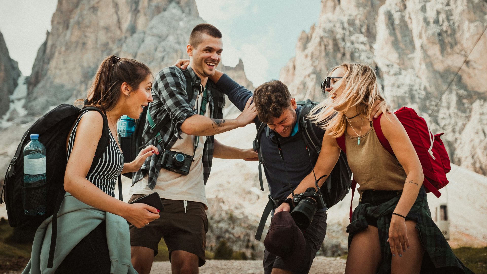 low-angle photography of two men playing beside two women