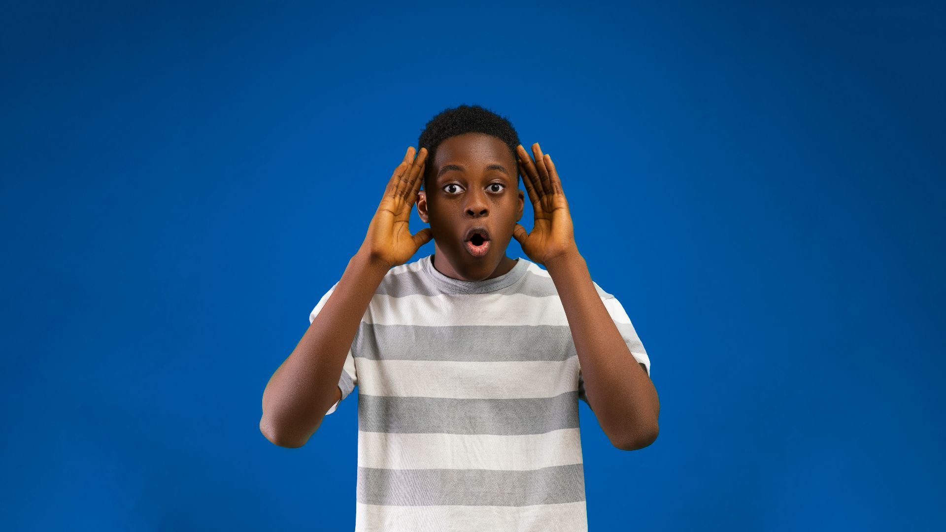 a woman with her hands on her face