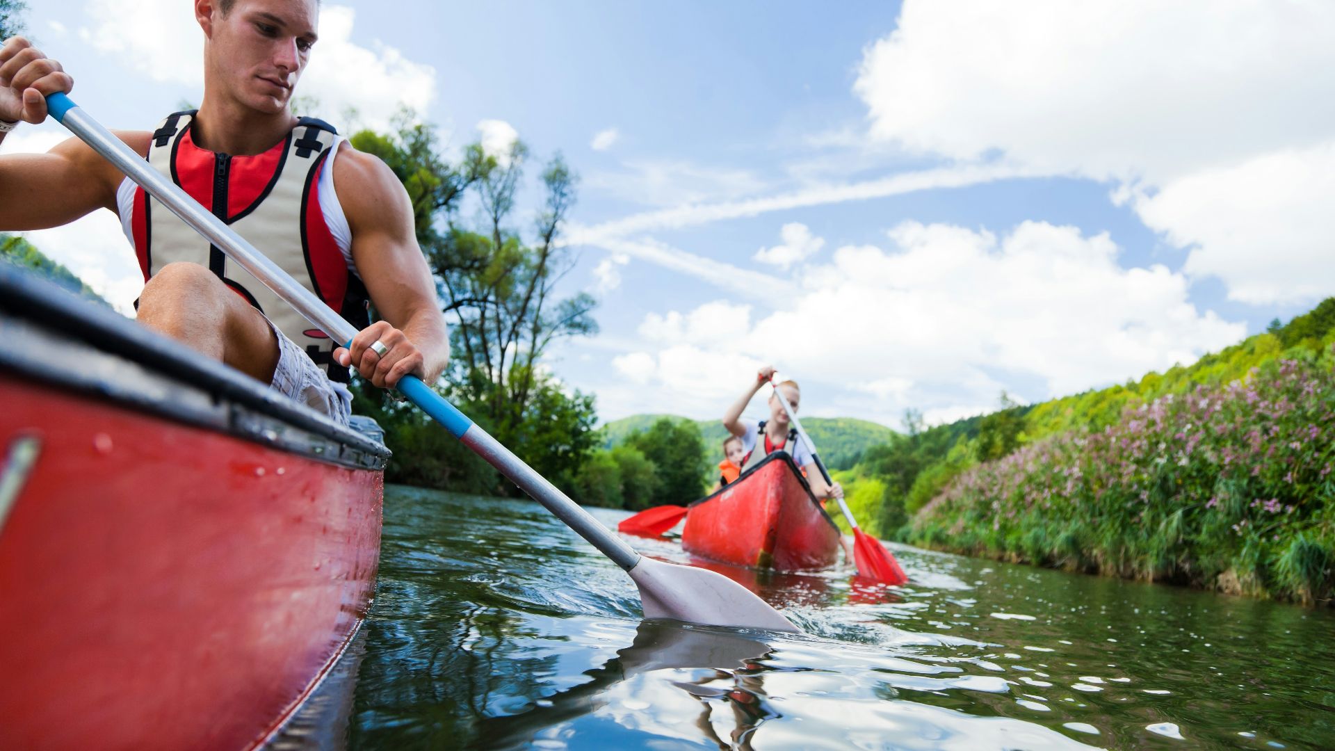photo of man and woman on kayak paddlings