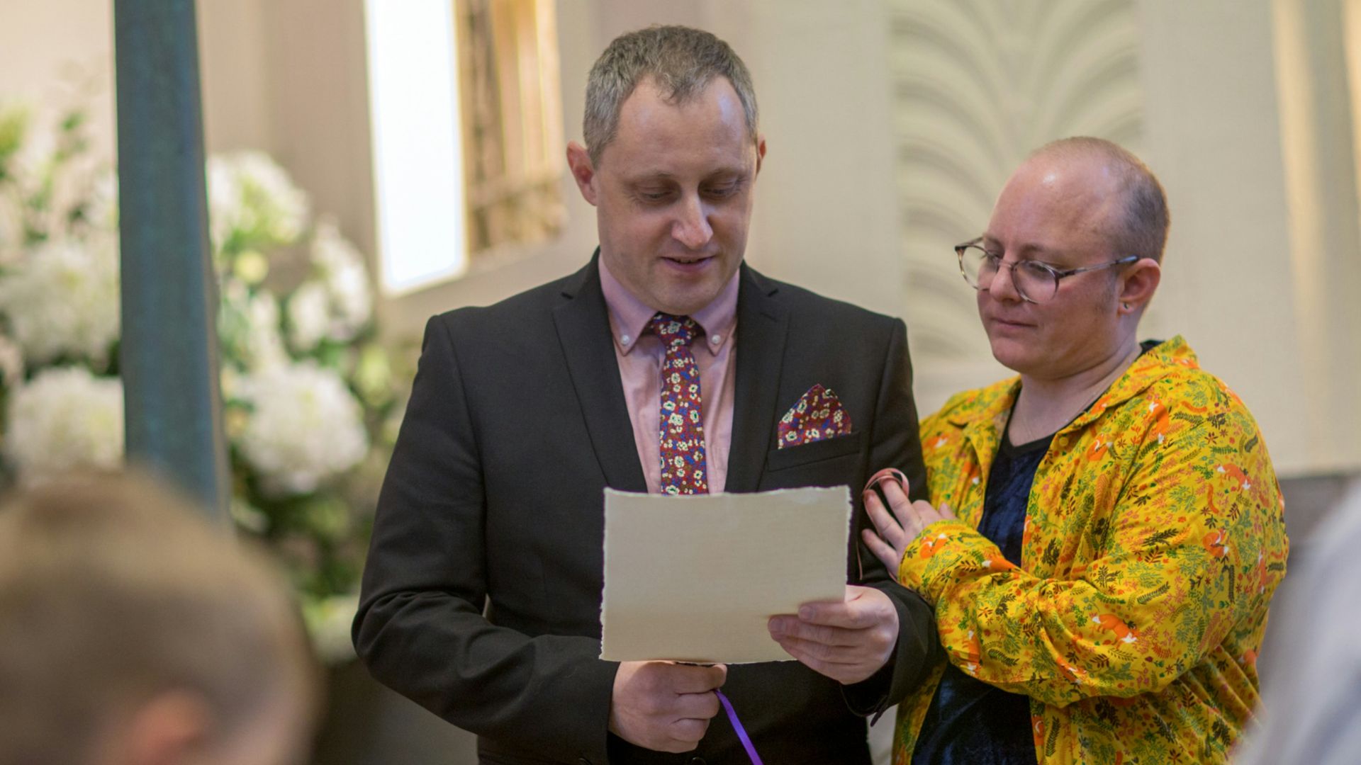 a man and a woman standing next to each other