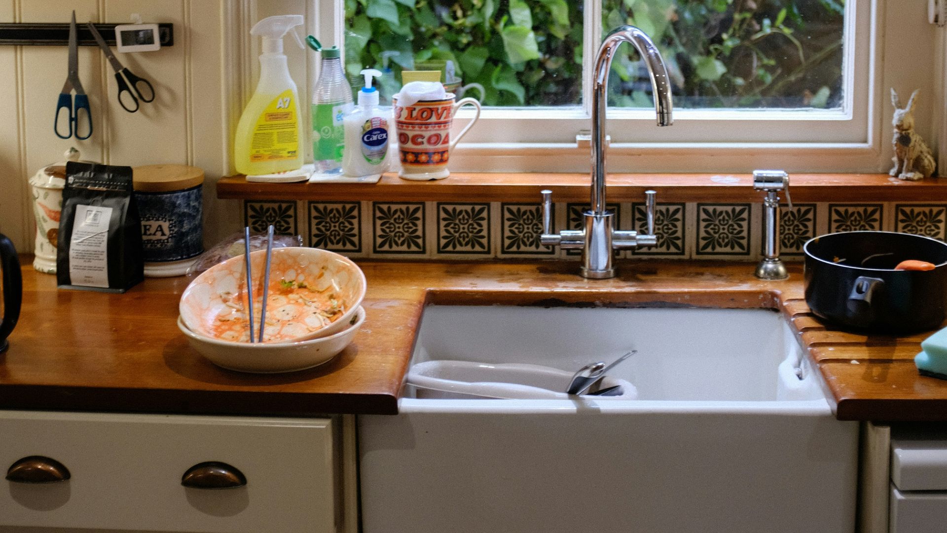 brown wooden round table with stainless steel faucet