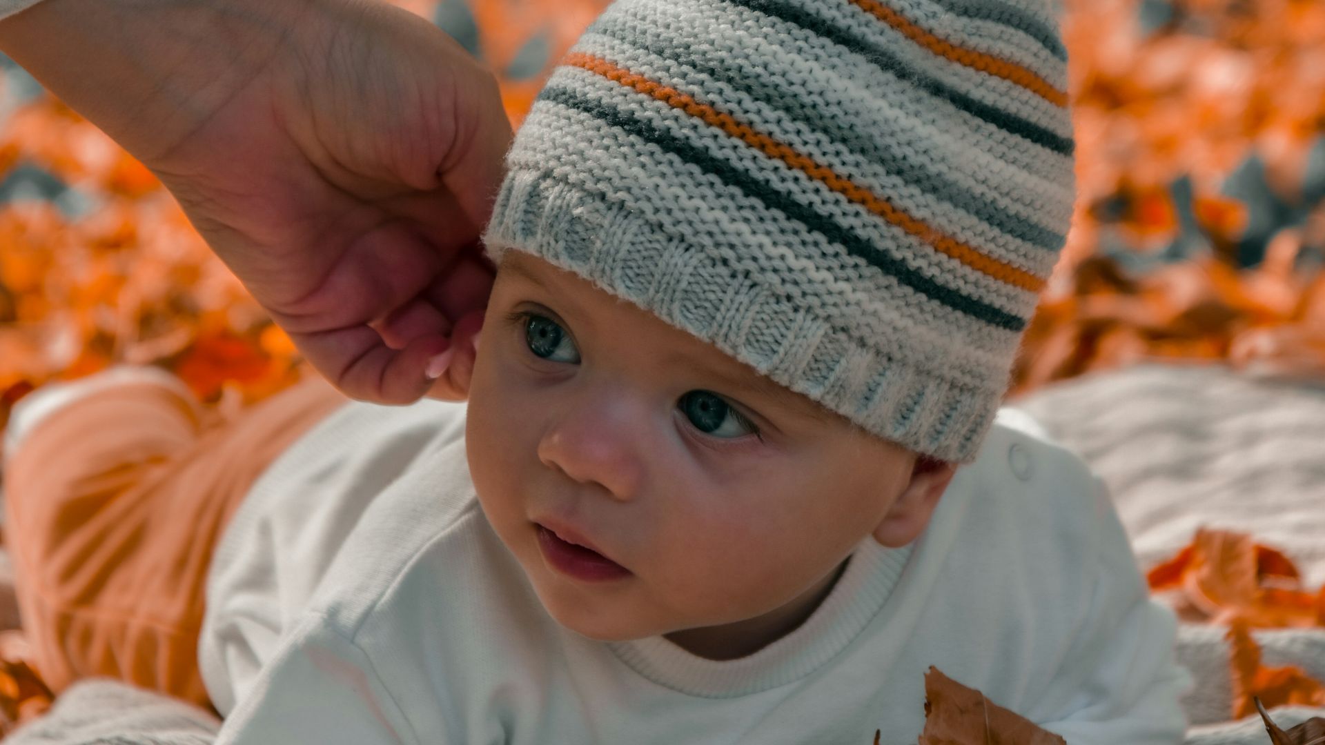 a baby in a knit hat