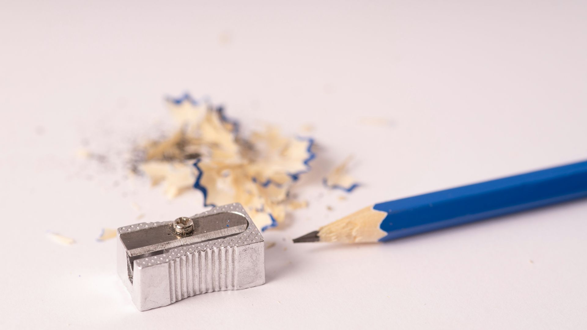 blue pencil sharpener on white surface