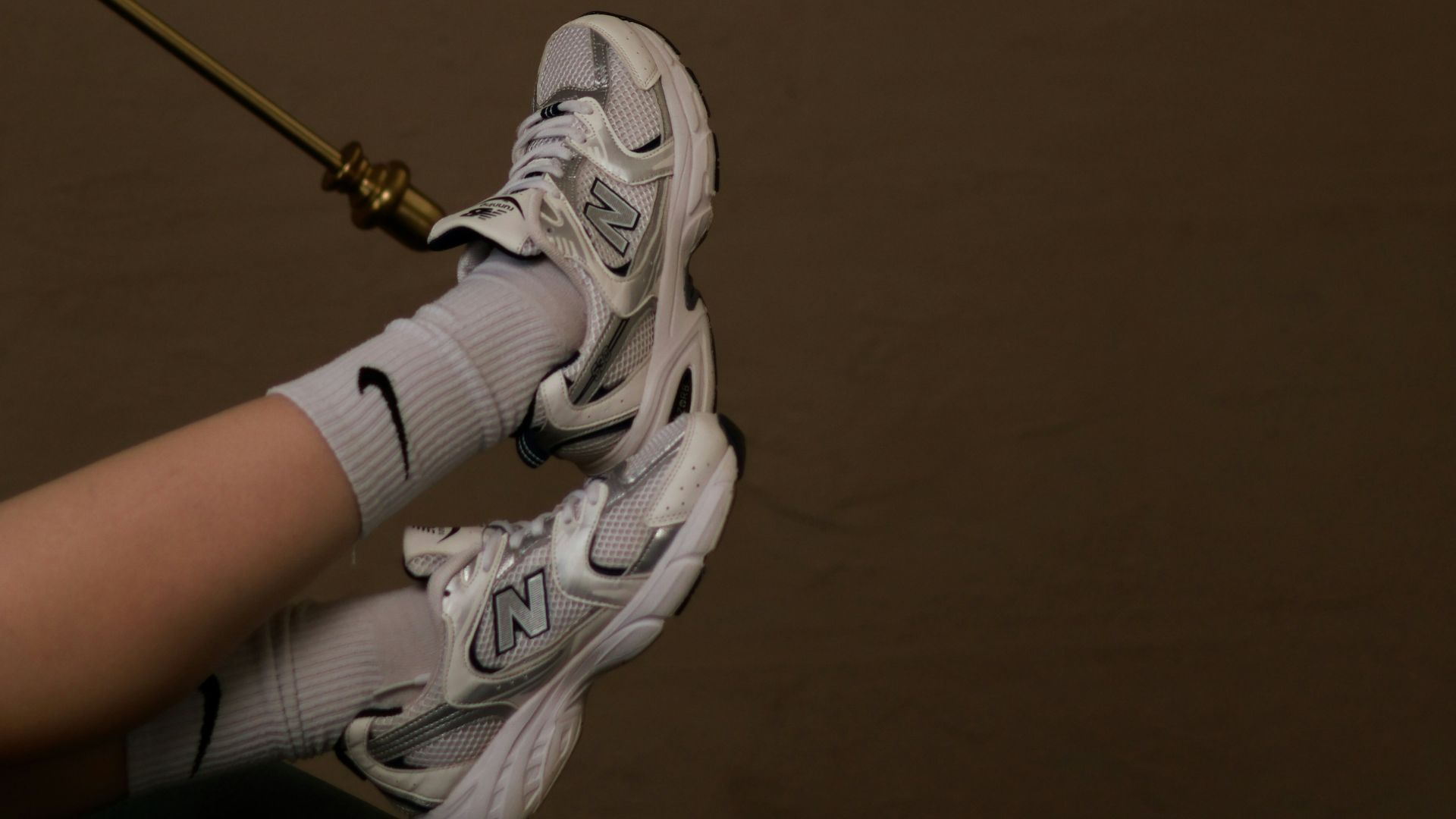 a person holding a tennis racquet on top of a tennis court