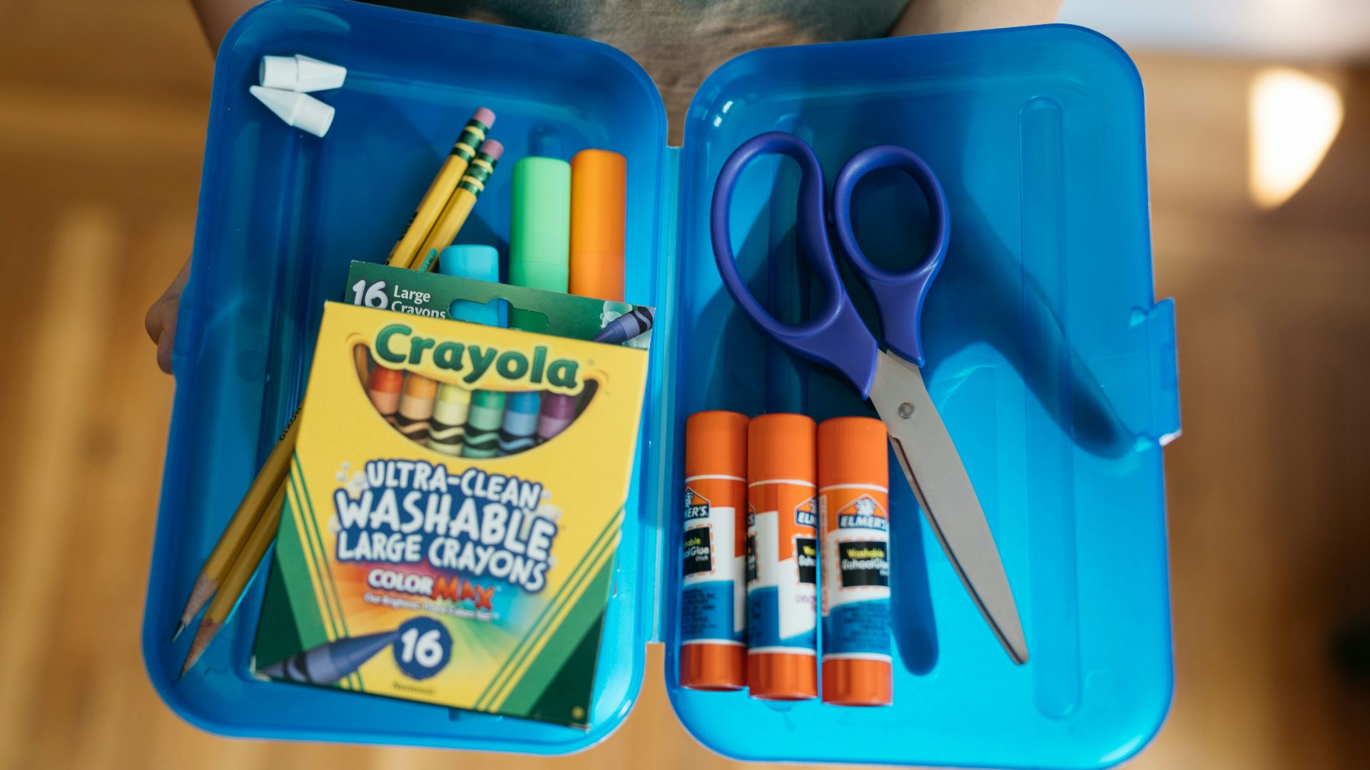 a bag of scissors and a package of scissors on a table