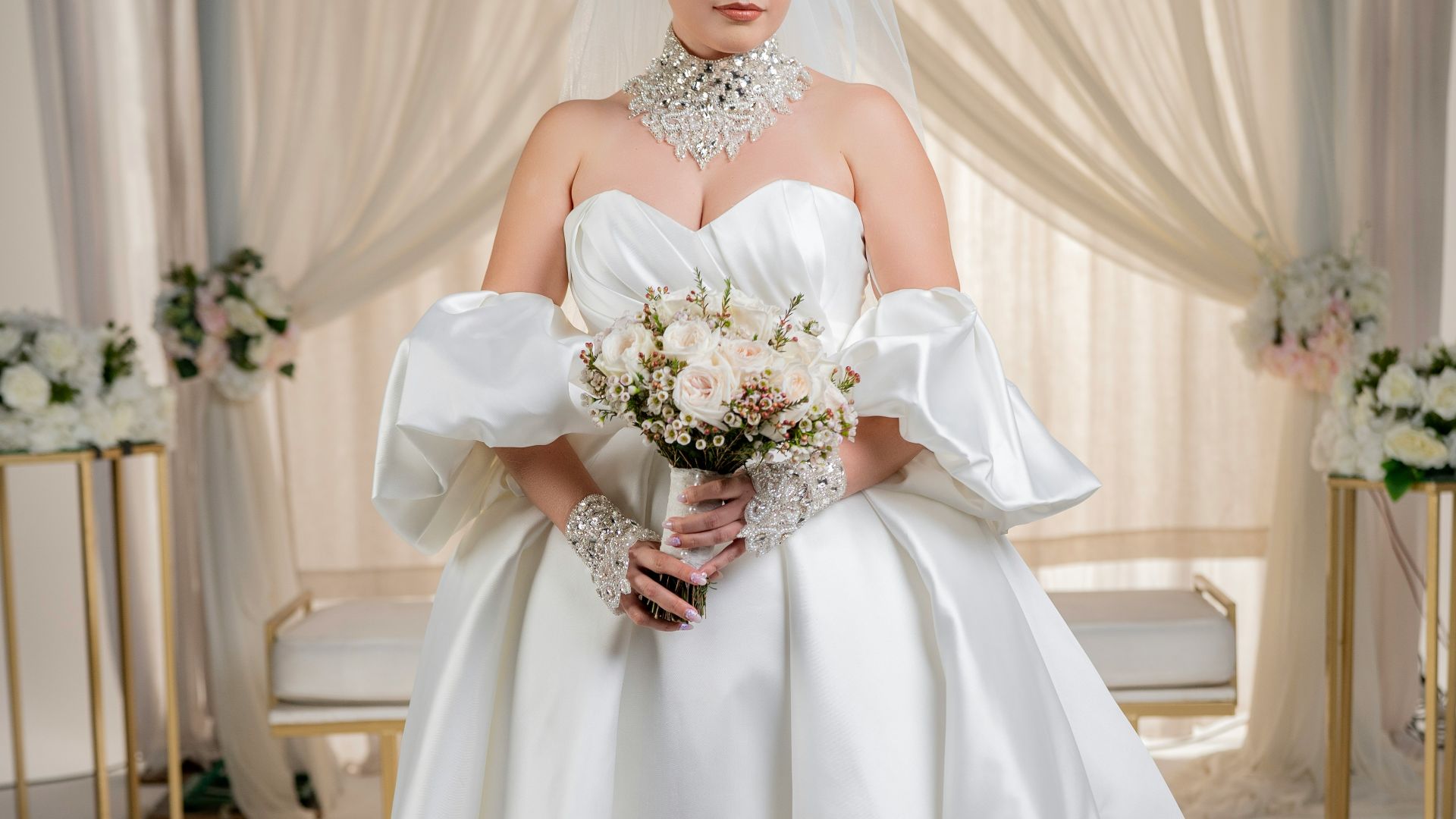 a woman in a white wedding dress holding a bouquet