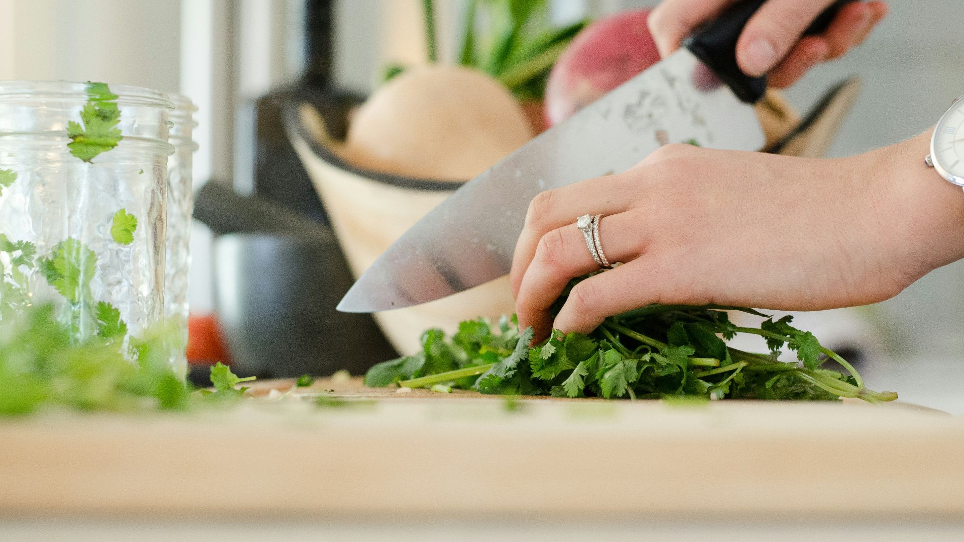 person cutting vegetables with knife